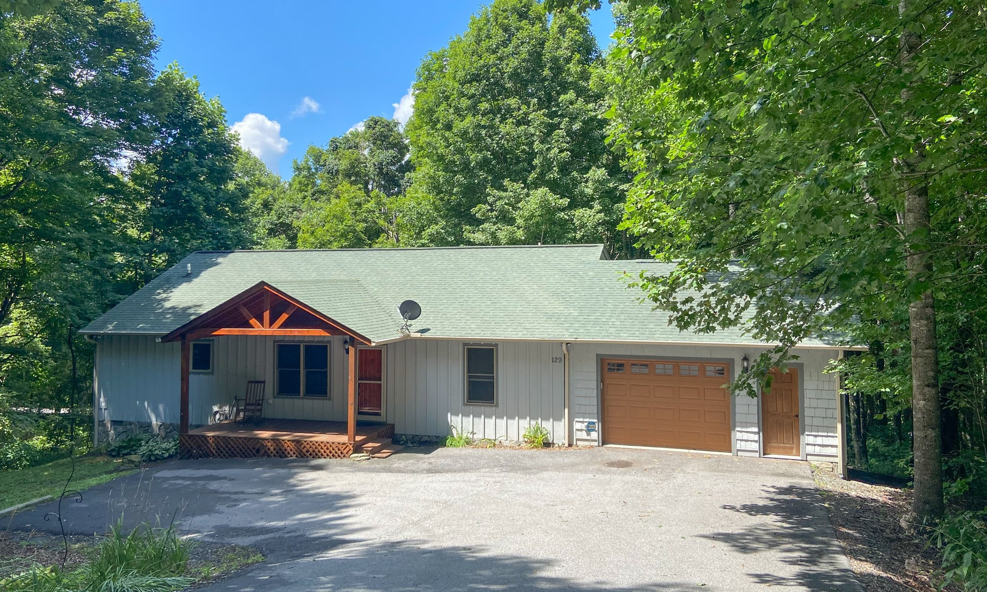 Find your "Happy Place"  here at this cozy 3-bedroom, 2-bath mountain cottage  nestled on a beautifully wooded mountain setting in Quail Ridge community just minutes from downtown West Jefferson in the North Carolina Mountains.