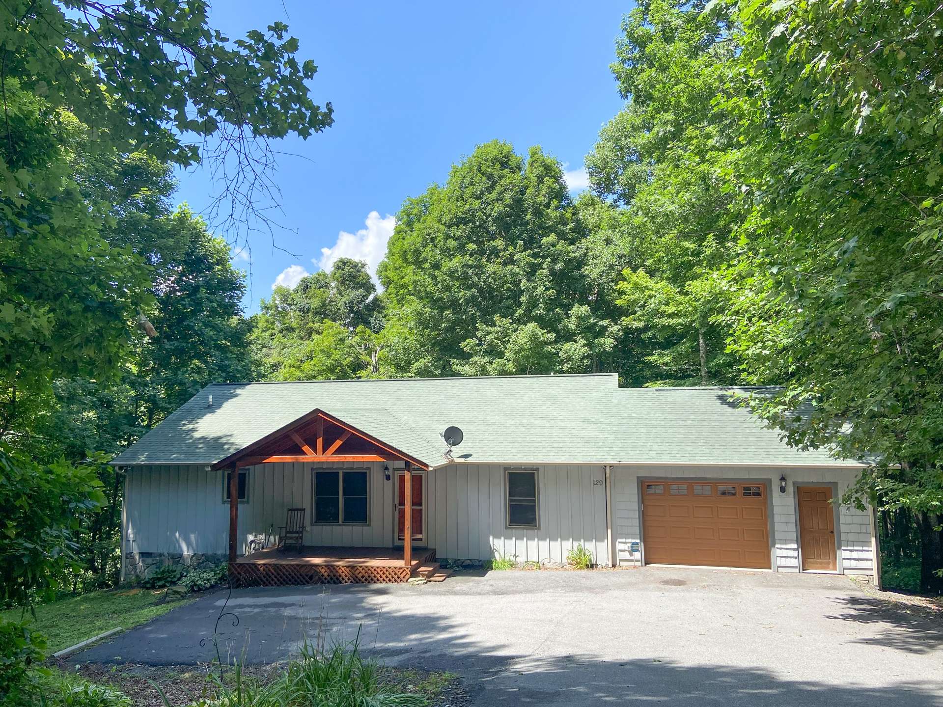 An oversized one car garage provides plenty of space for outdoor toys, equipment, or workshop area/  This sweet  NC Mountain cottage is perfect for first-time home buyers, small family, vacation home retreat, or vacation rental, and only 13 minutes to West Jefferson and 37 minutes from Boone, NC.  Call for information on listing P112.