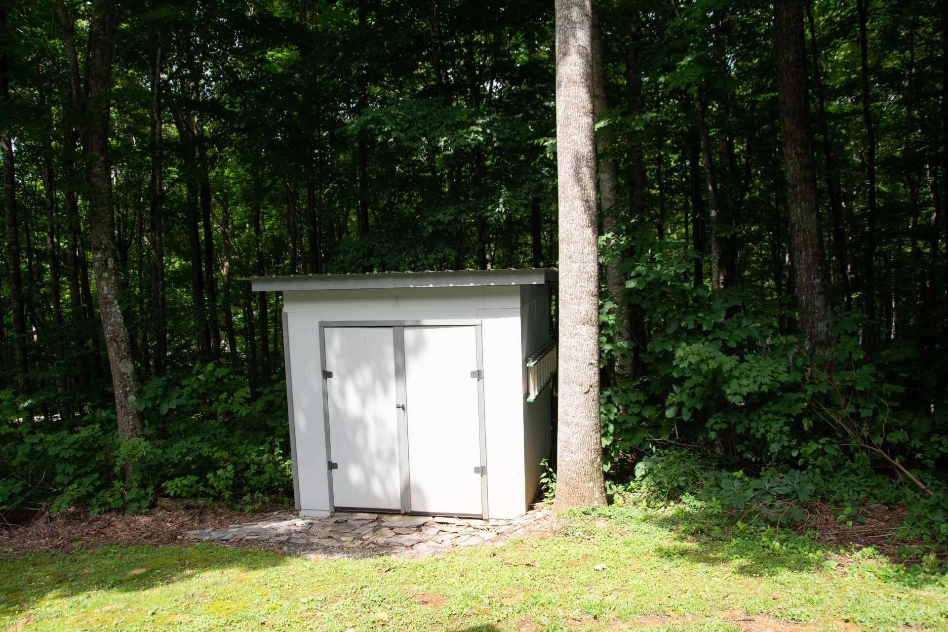 Also included is this outdoor storage building for your yard and gardening equipment.