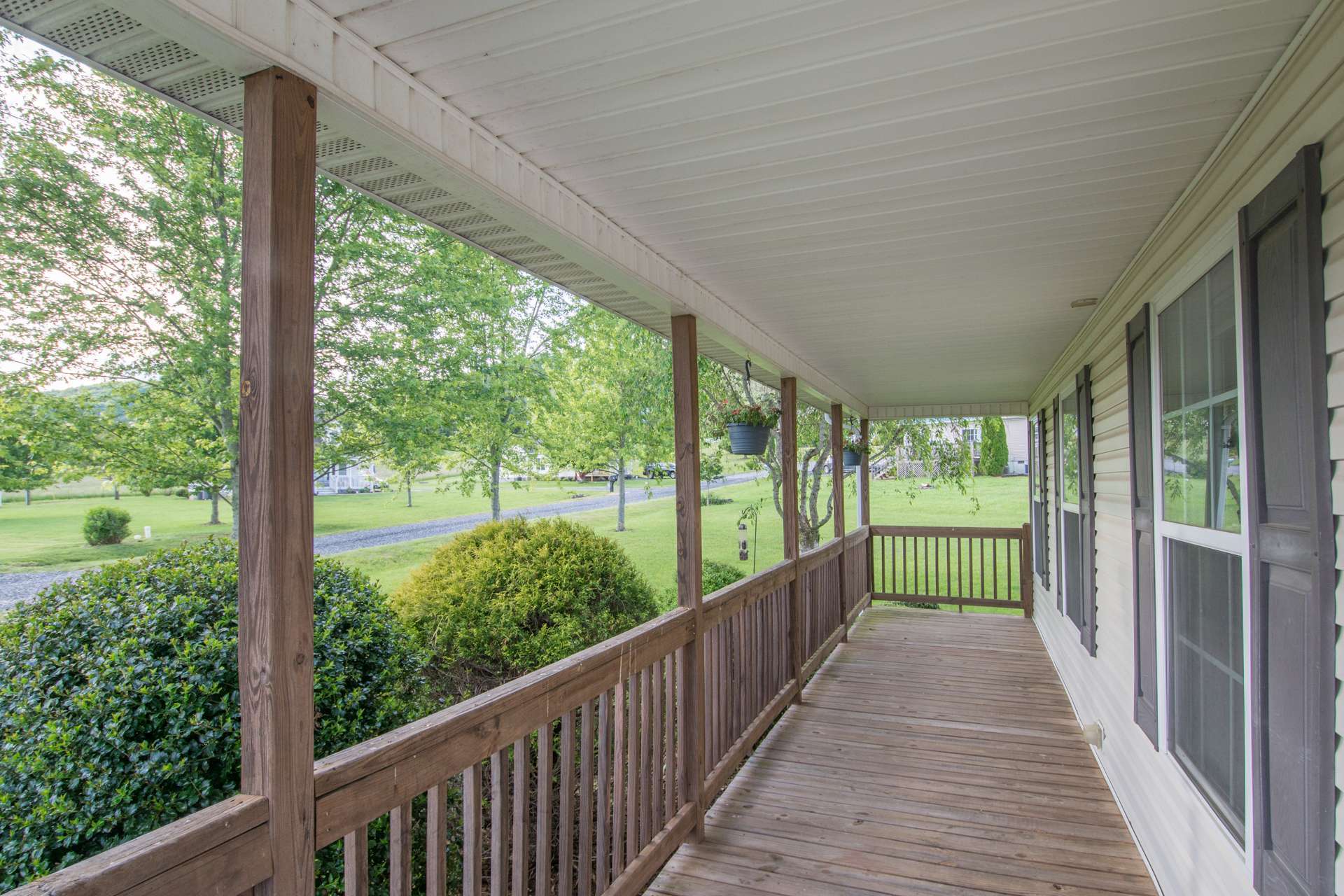 You will enjoy the full length covered front porch as well as the open back for grilling. There is an outbuilding for storing gardening tools and equipment.
