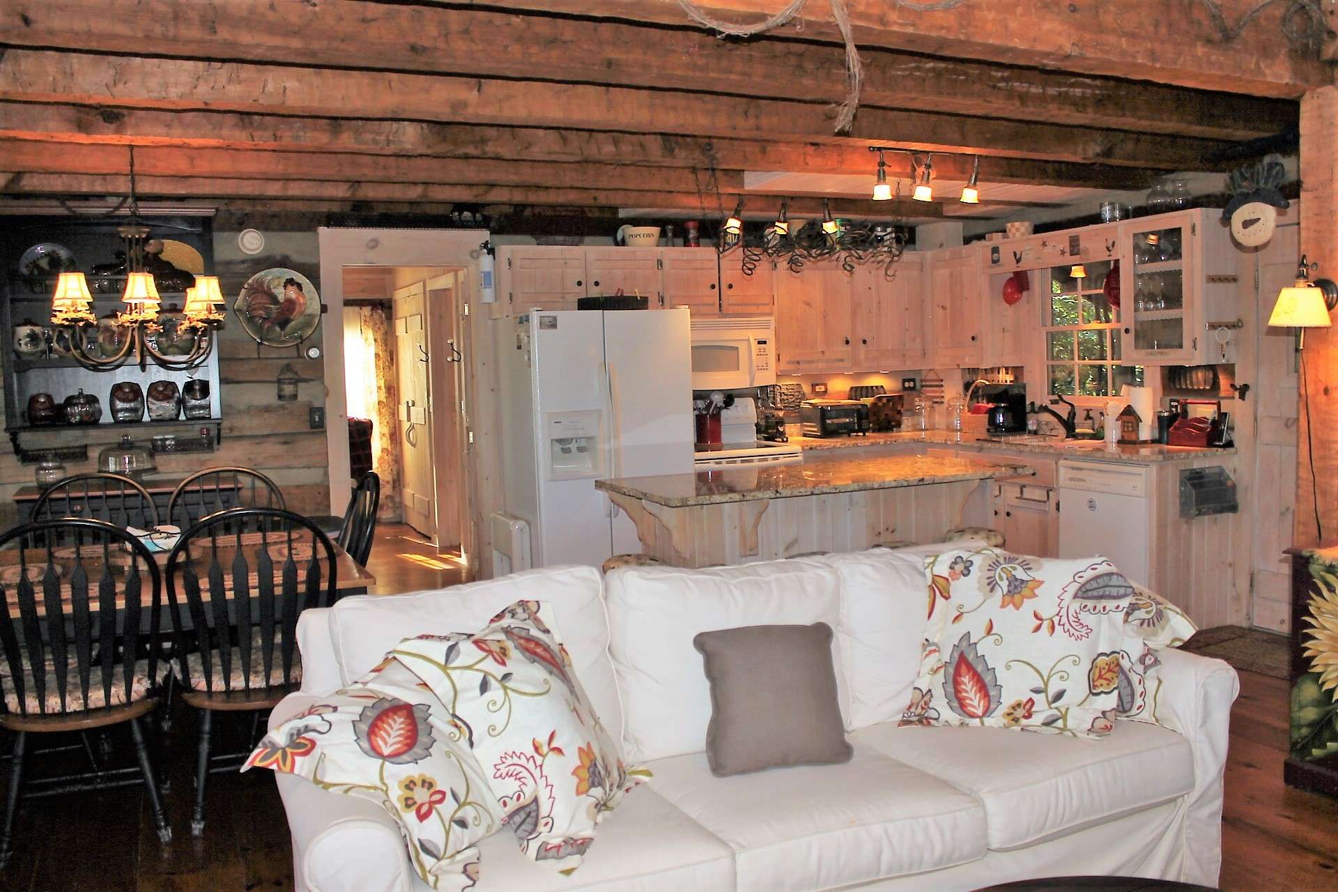 Beamed ceilings bring a rustic touch while white washed accents keep it light.