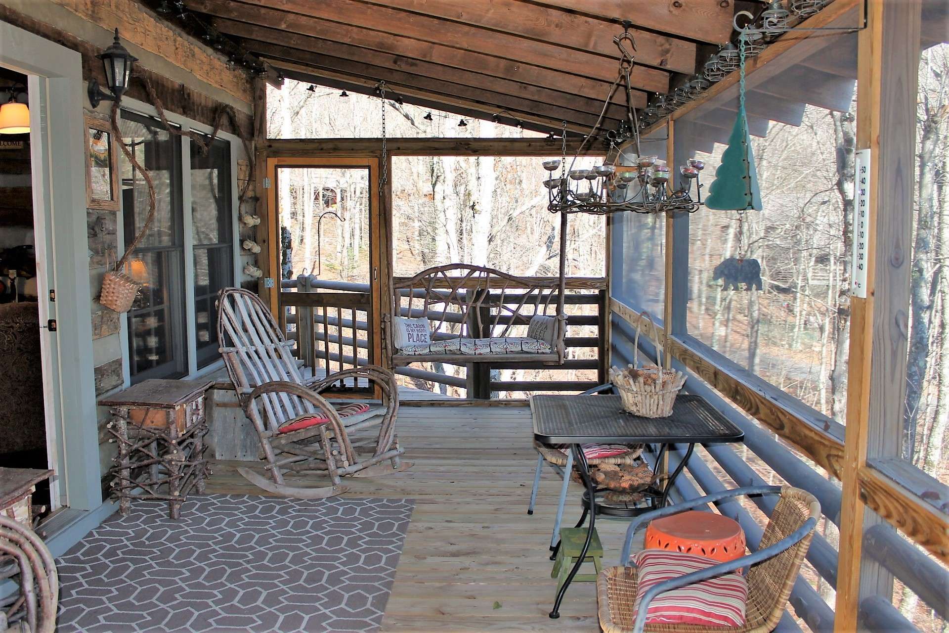 The covered screened porch is ideal for sitting in a rocker or swing sipping your favorite beverage and enjoying the cooler mountain temperatures.