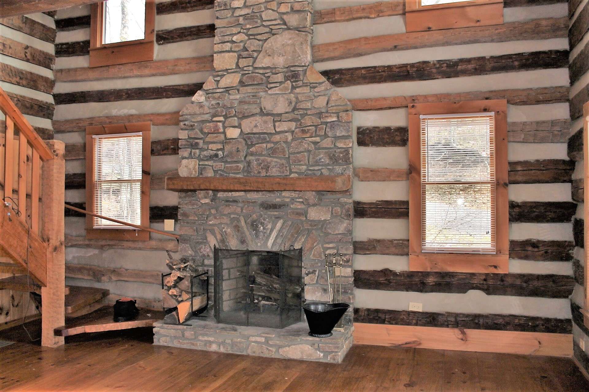 Four windows flank the fireplace to bring in ample light.