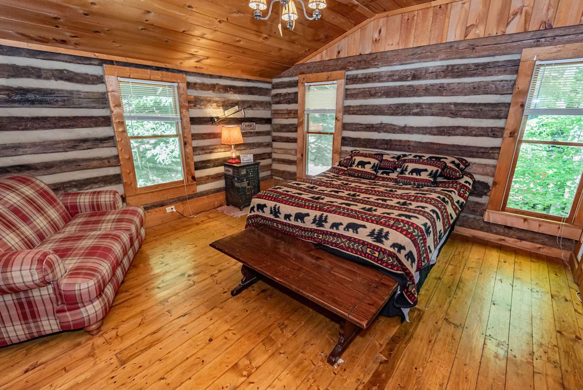 Windows all around in this spacious second guest bedroom on upper level.