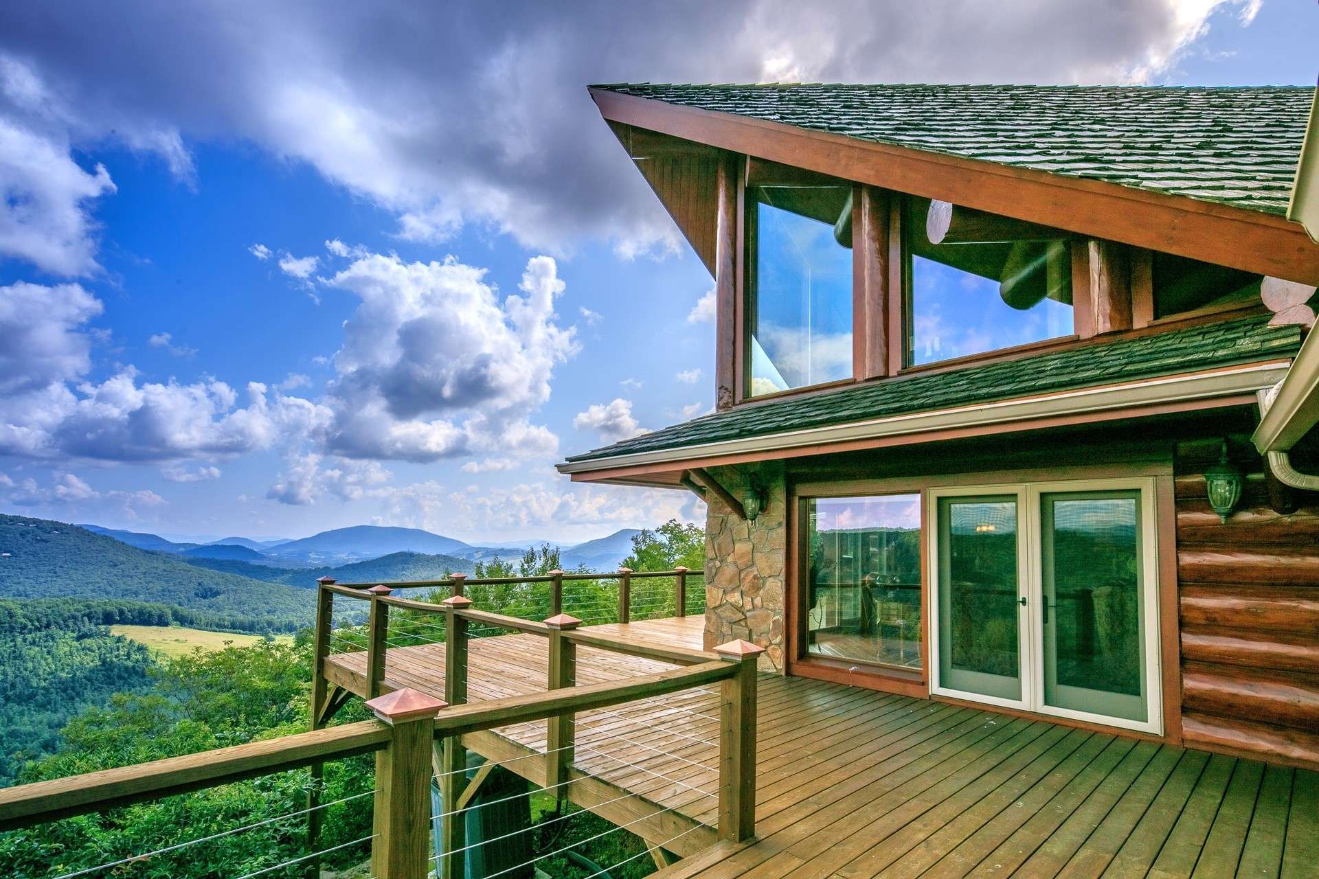 This mountaintop oasis offers end-of-the road privacy, a stunning log home, guest house (both furnished,) and 19 beautifully wooded acres offering additional home sites, if desired.