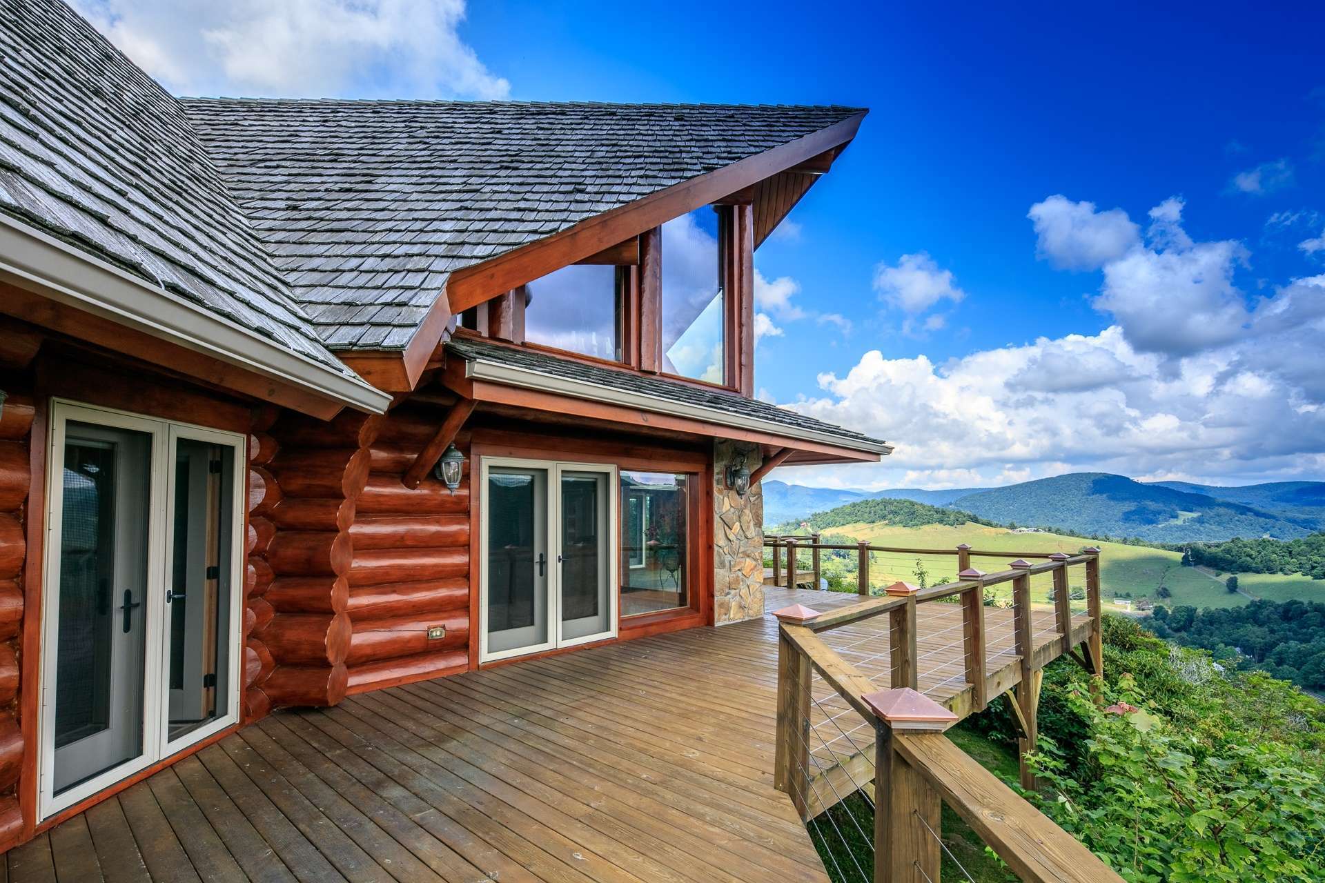 Expansive decking provides plenty of space for outdoor entertaining. Or, simply relax with your favorite beverage while enjoying the views and gentle mountain breezes.