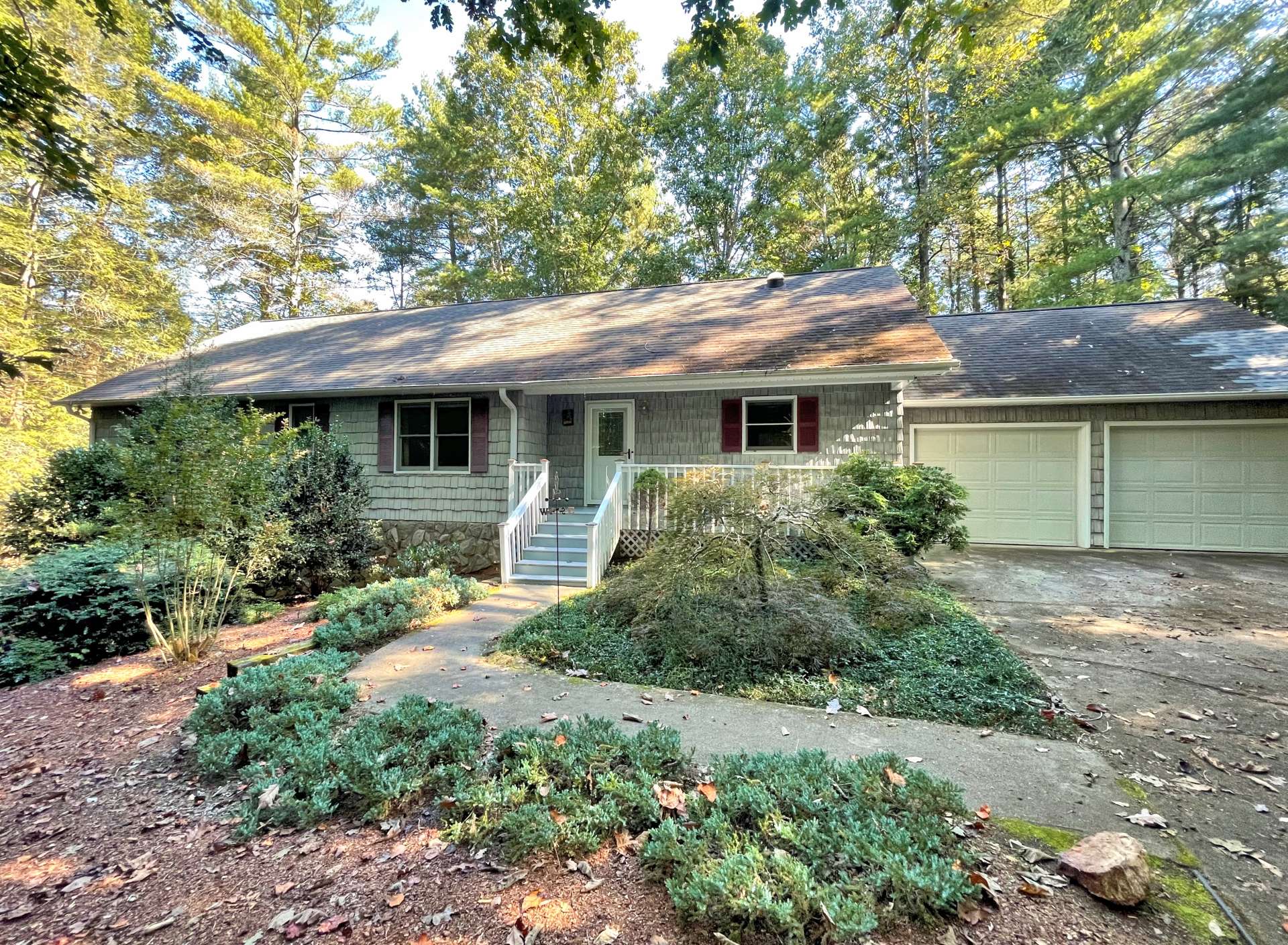 Private wooded setting with 2 car attached garage.