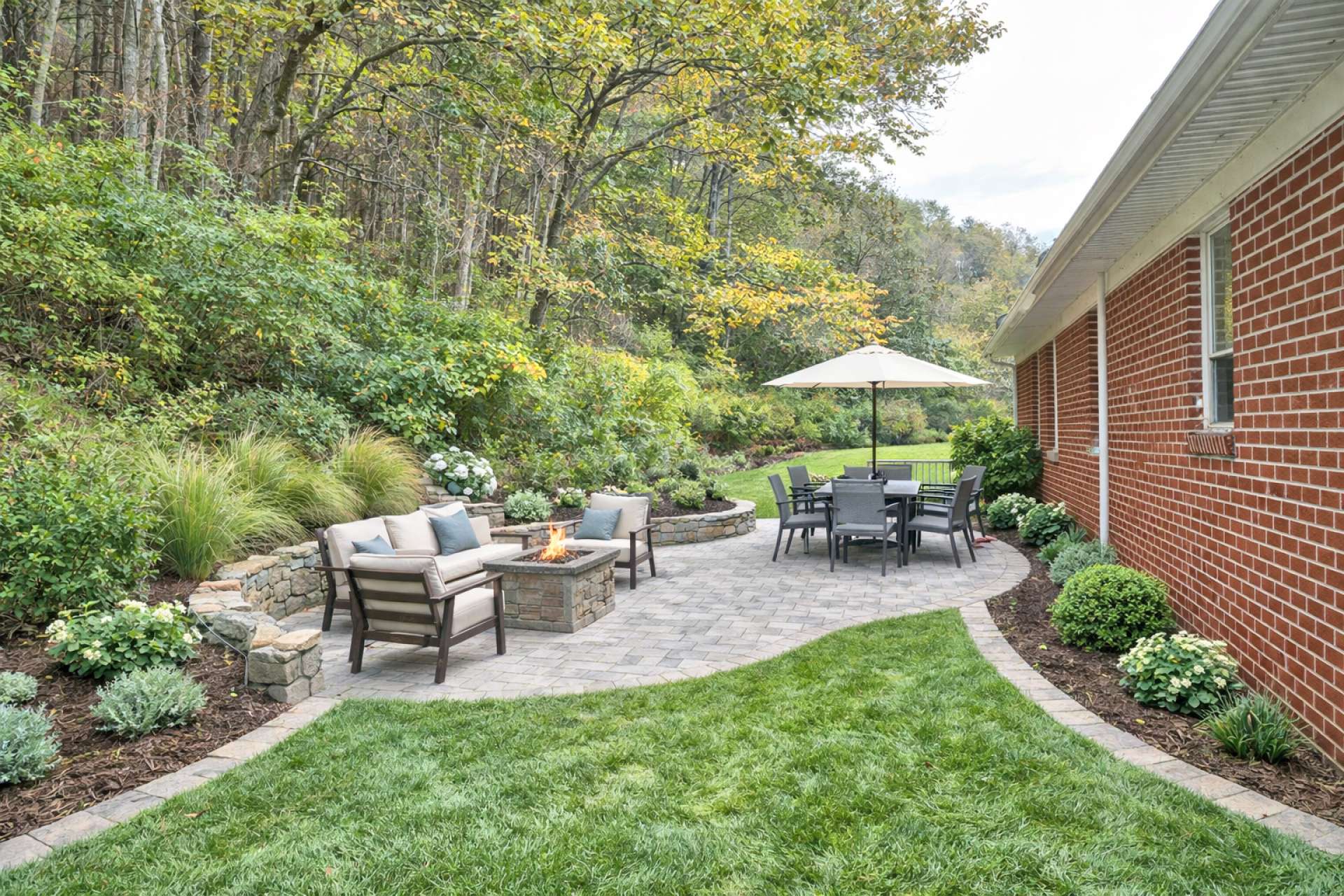 This virtual-generated photo shows how a bit of cleaning up, landscaping, and firepit with patio furniture can create an inviting outdoor space for entertaining.