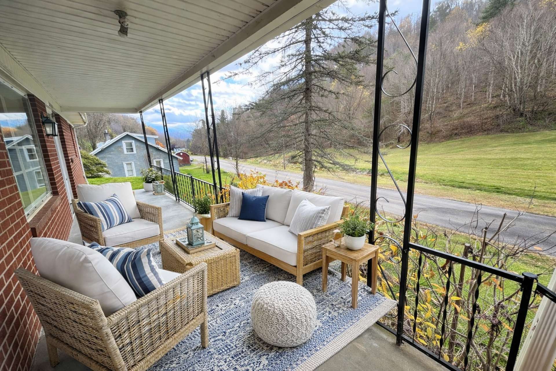 This virtual-generated photo shows how adding porch furniture can give you a relaxing afternoon on the porch, enjoying the view and the sounds of the creek across the road.