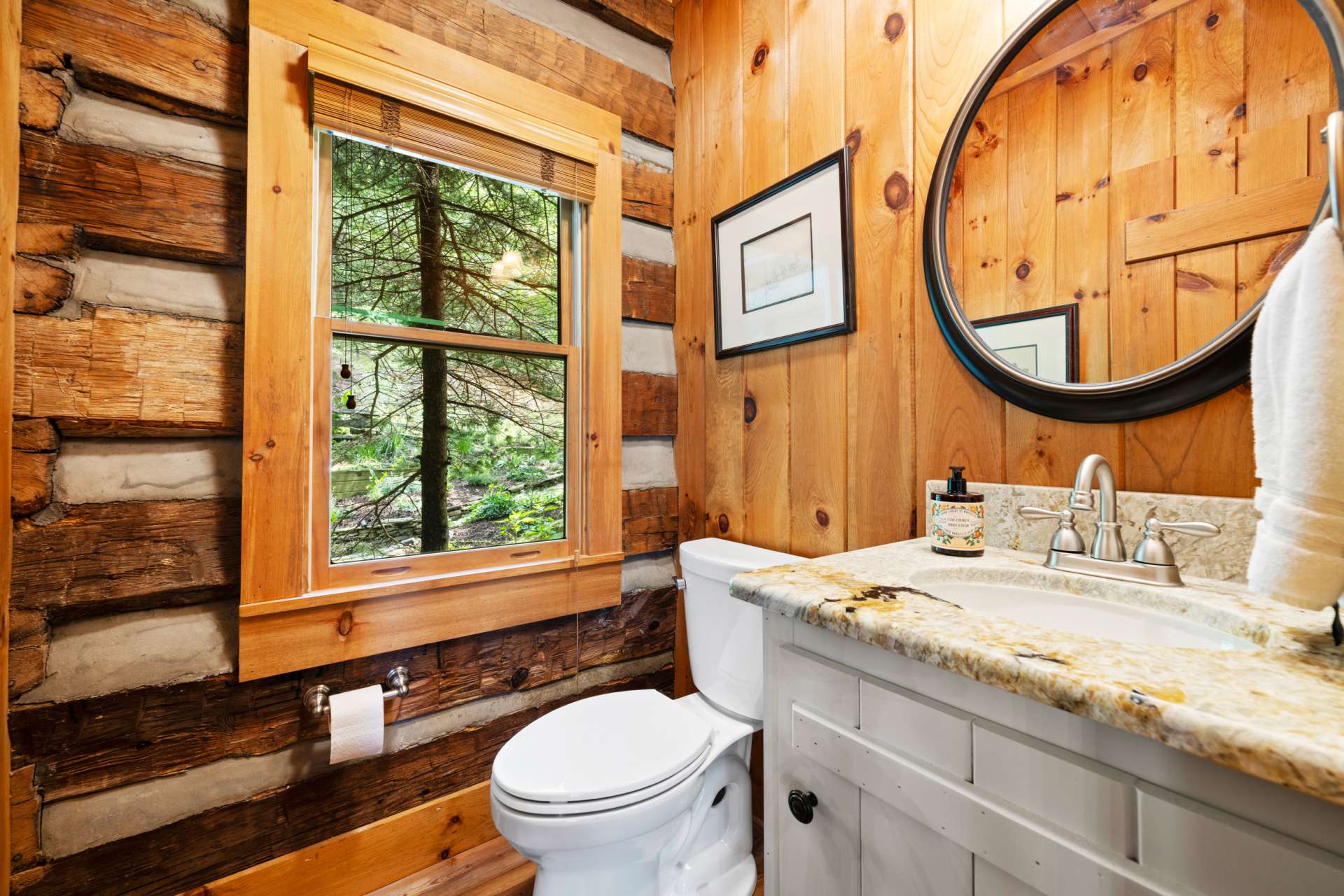 The half bath just off the kitchen and dining area is convenient for both guests and homeowners.