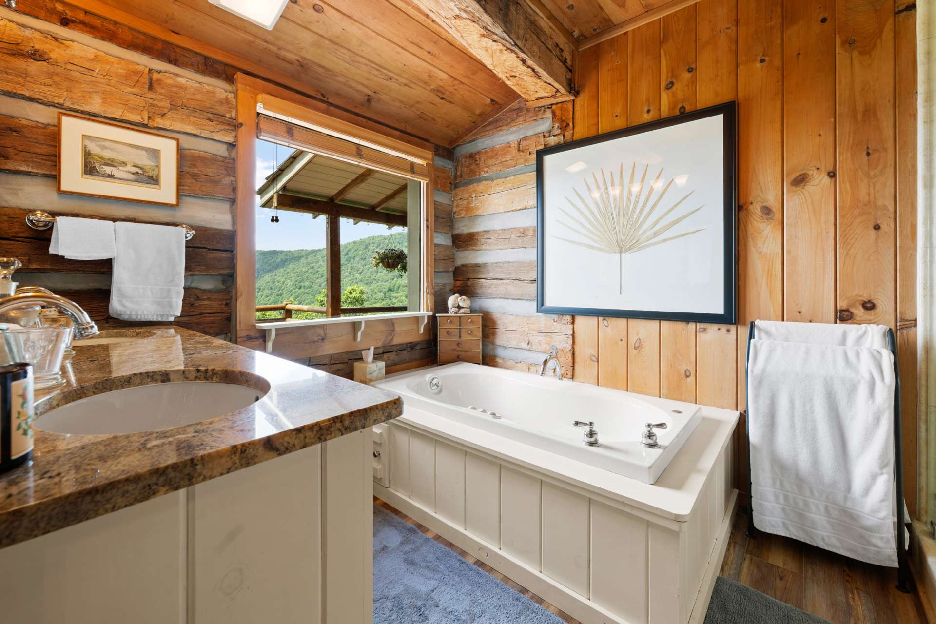 A spa-inspired retreat with double vanities, granite countertops, a soaking tub, and a large tiled shower.