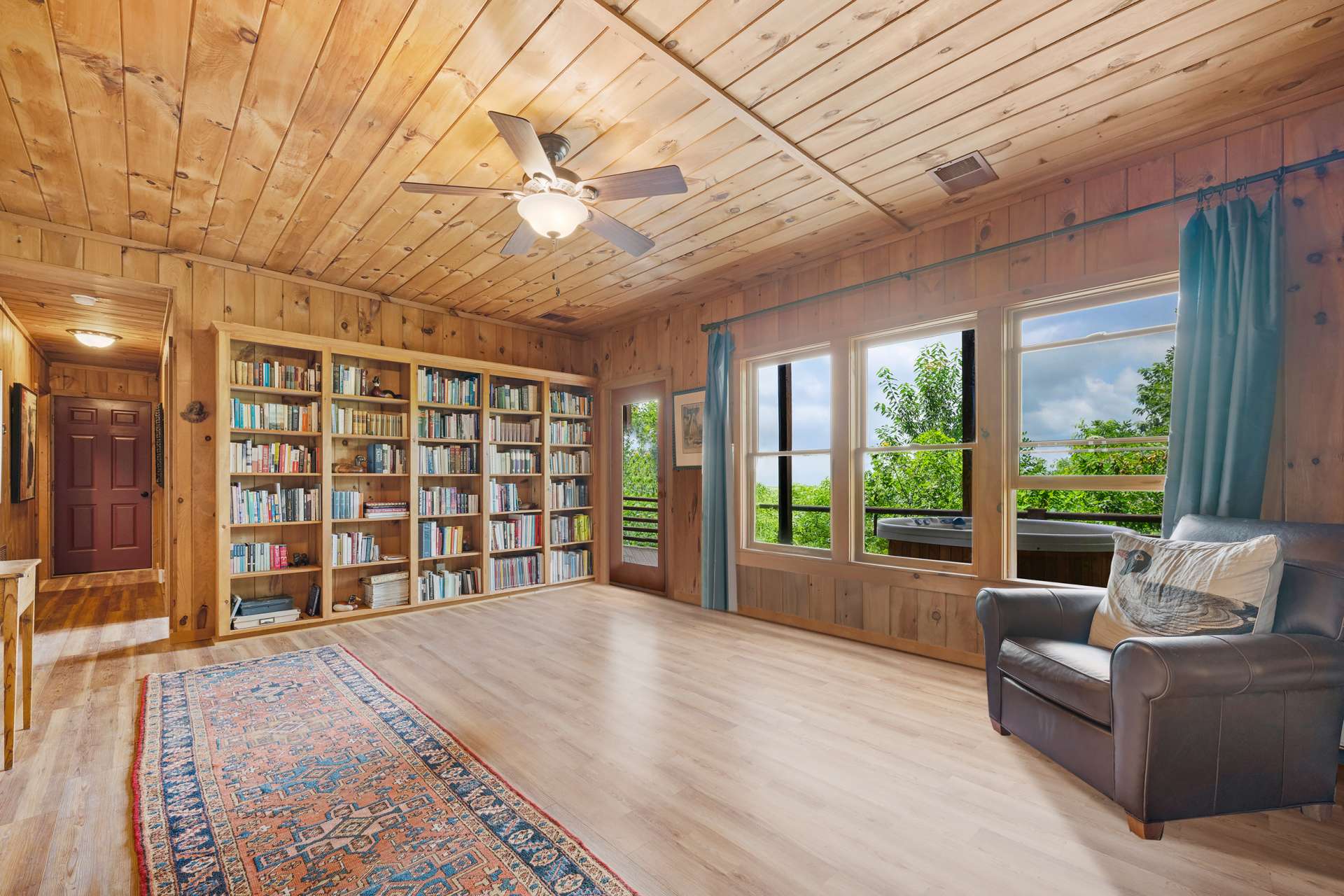 This room features a custom-built bookshelf, perfect for displaying your collection, a spacious walk-in closet with custom shelving, and a secondary closet ideal for wine storage.
