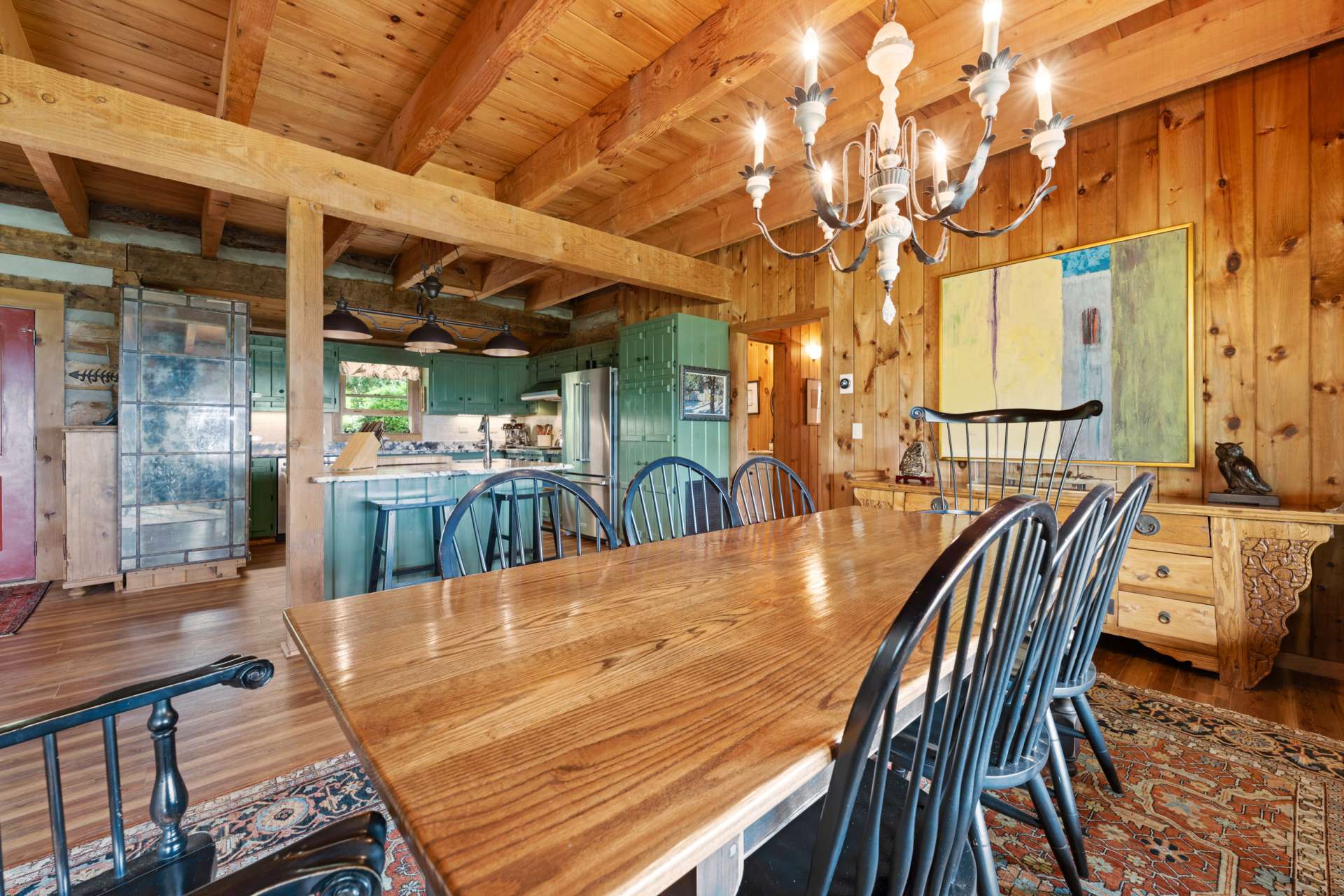 All areas of this home are spacious and designed for fabulous entertaining with ease and comfort. Meticulously cared for cabin with numerous upgrades such as engineered flooring for carefree maintenance and custom wrought iron hardware on doors and cabinets.