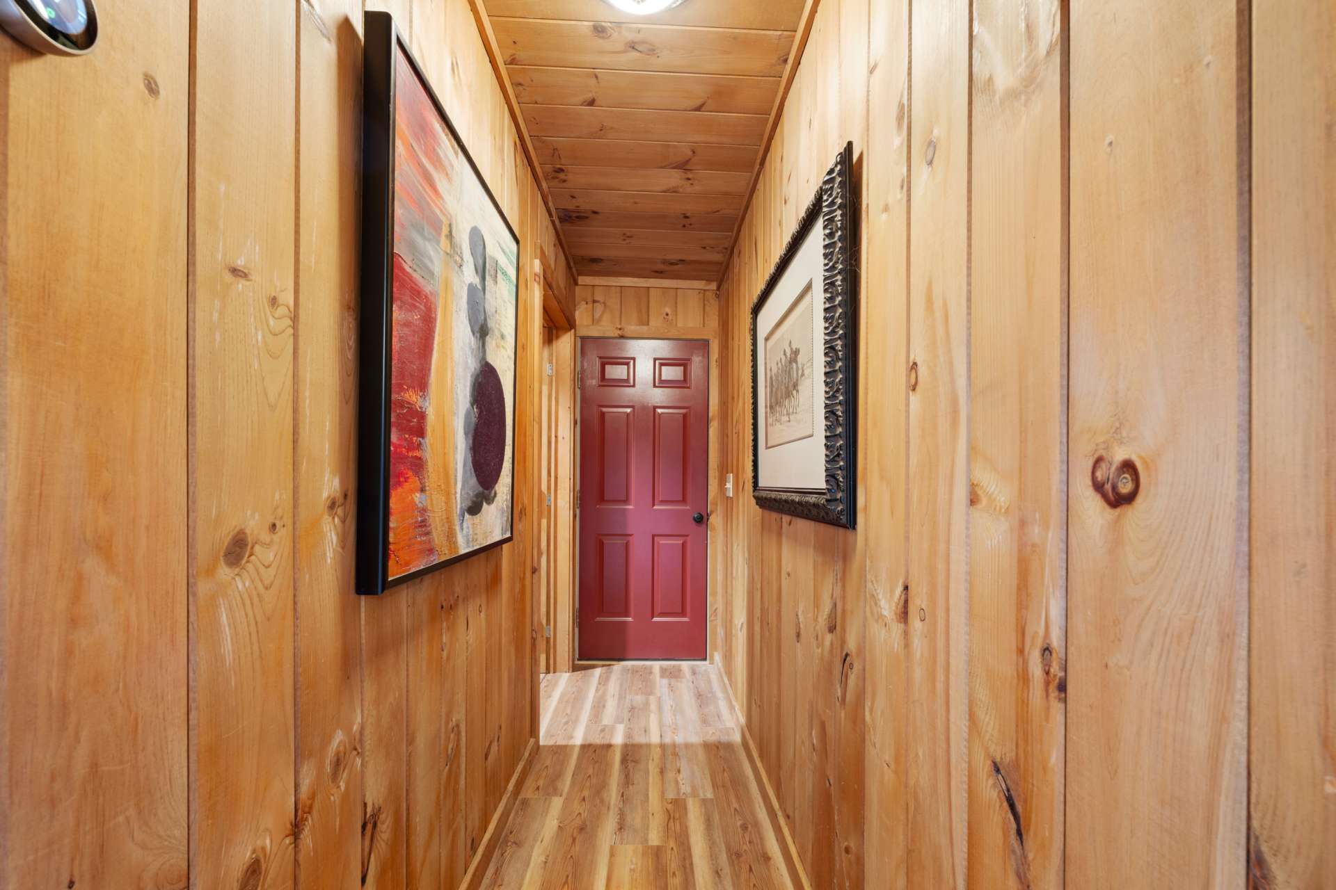 Lower hallway leads to a utility room and garage.