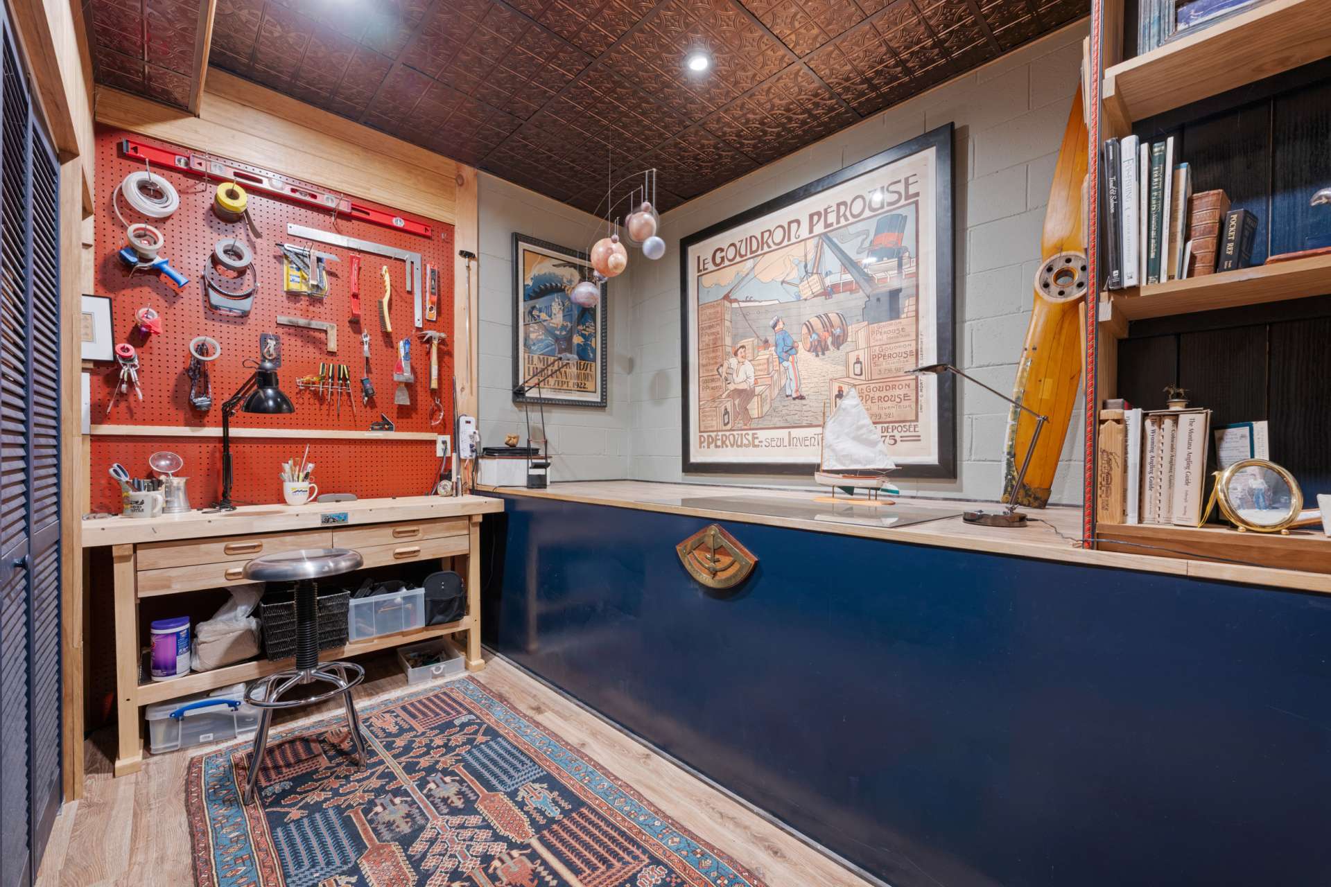 The utility room also serves as a well-designed hobby area, ideal for crafting, repairs, or seasonal projects.