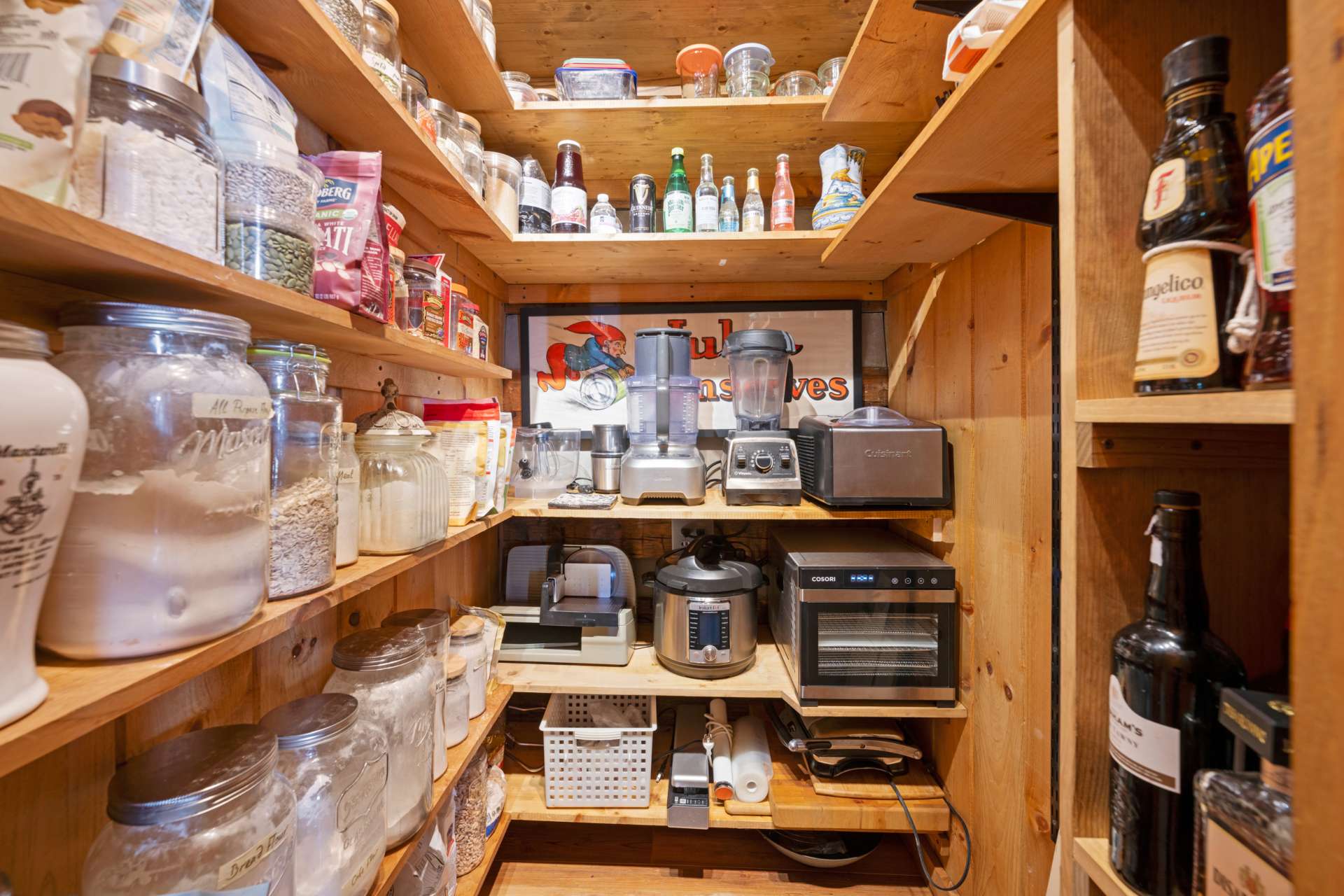 This home has two pantries- one in the kitchen with pull-out shelving, and a separate large walk-in pantry that is electrified — you can run your slow cooker or ice cream maker straight from the pantry.