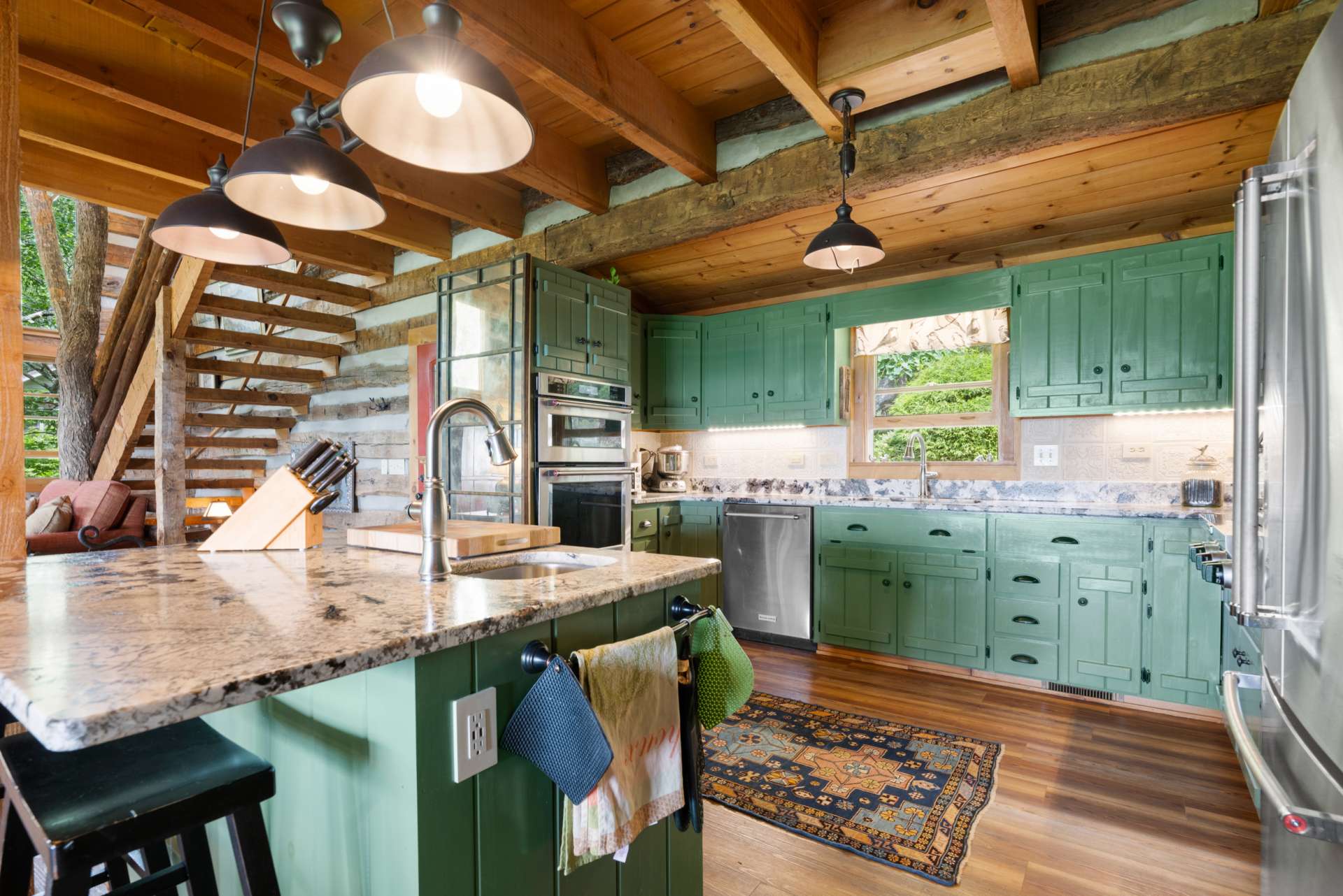 The large center island creates a casual seating area, additional prep space, vegetable sink and storage. Separate walk in pantry not pictured.