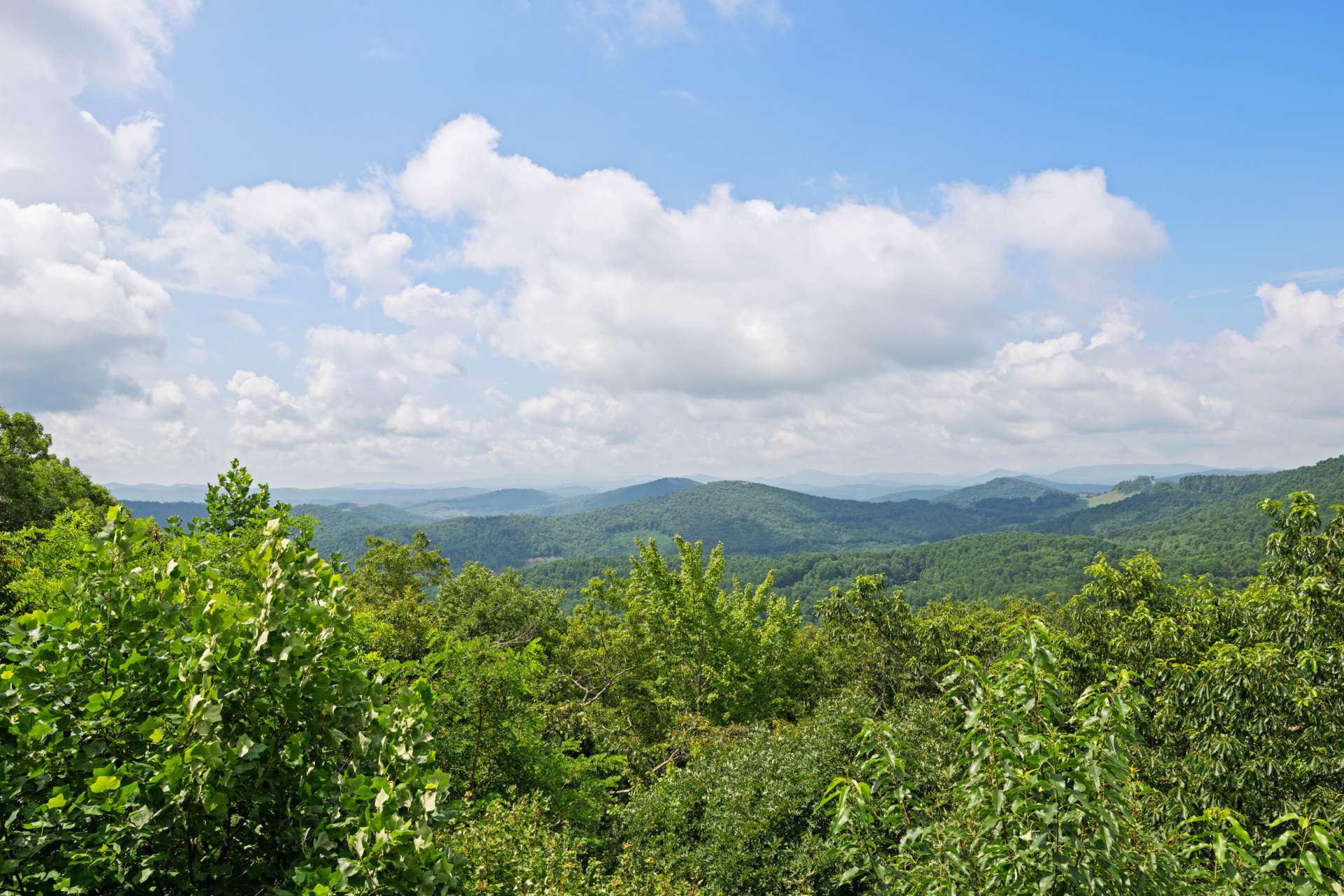 Unforgettable majestic views stretch across the horizon with layers of mountain ridges culminating in a perfect view of Grandfather Mountain.