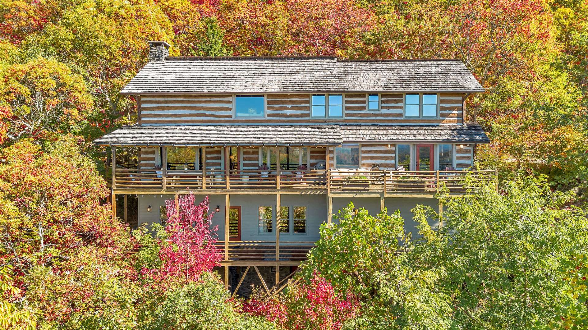 Relax and connect with a stunning backdrop of mountain ridgelines stretching as far as the eye can see. Cedar shake roof replaced in 2021