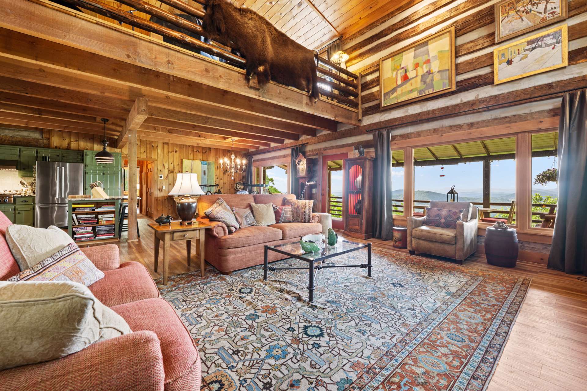 Enjoy captivating views through the wall of windows while relaxing in the comfort of the great room, where nature feels like part of the décor.