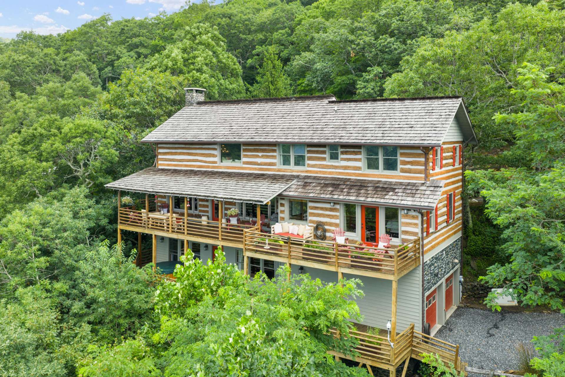 Every outdoor space invites you to relax and connect—with a stunning backdrop of mountain ridgelines stretching as far as the eye can see. Cedar shake roof replaced in 2021.
