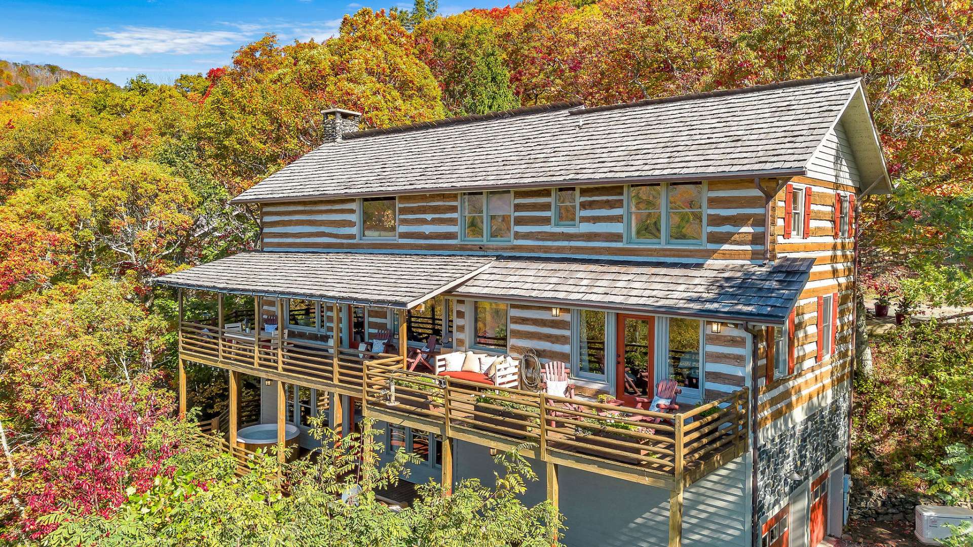 Every outdoor space invites you to relax and connect—with a stunning backdrop of mountain ridgelines stretching as far as the eye can see. Cedar shake roof replaced in 2021.