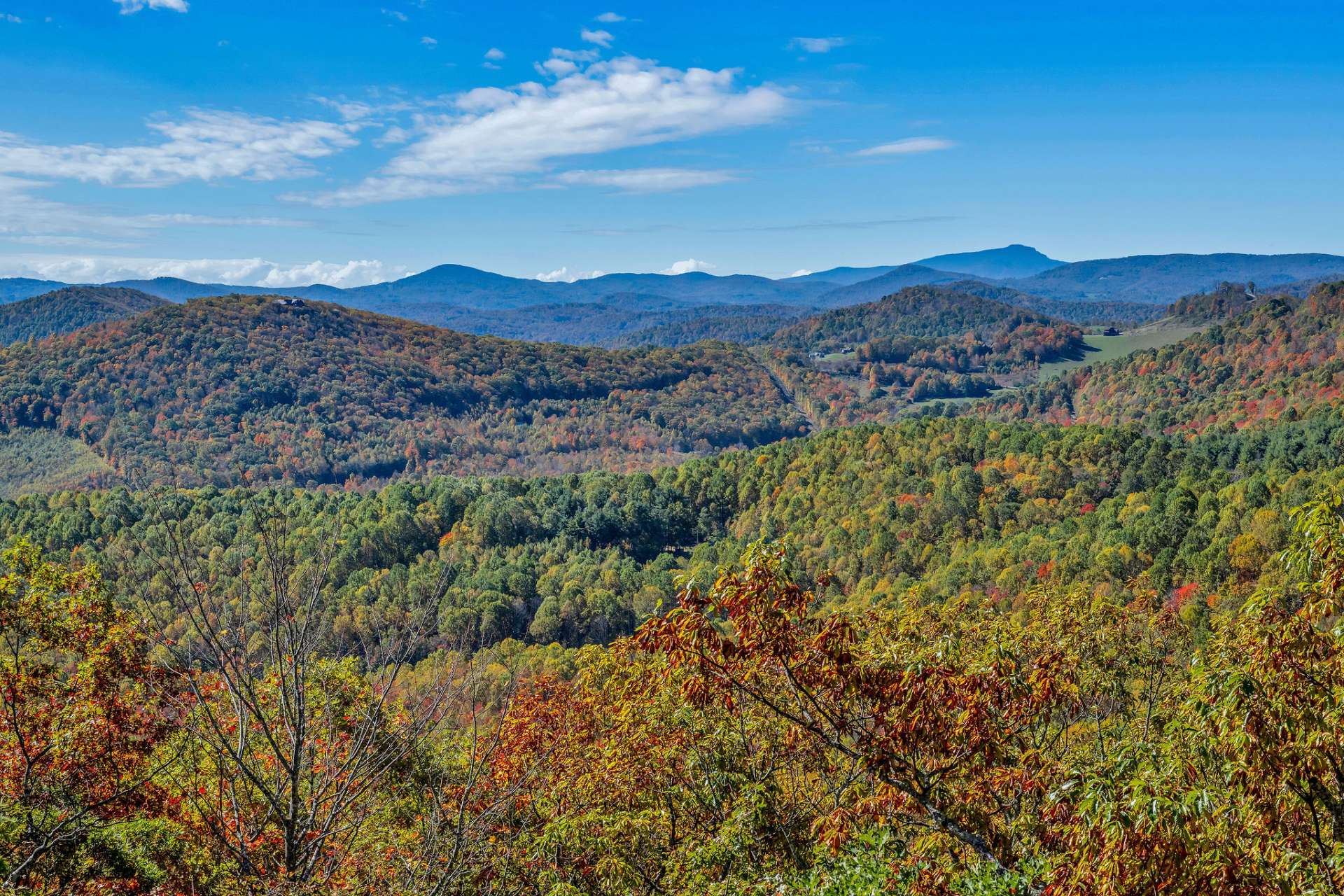 Unforgettable, majestic views stretch across the horizon with layers of mountain ridges culminating in a perfect view of Grandfather Mountain.