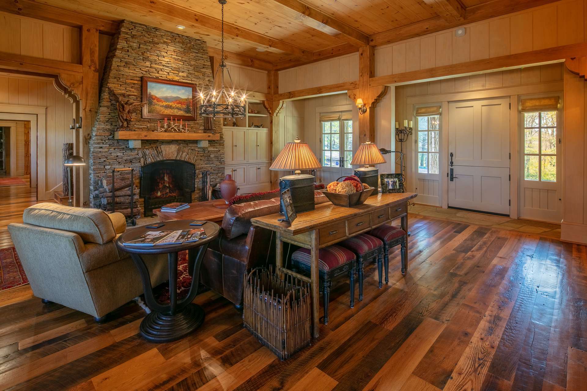 The main level boasts reclaimed wood floors and architectural beams.