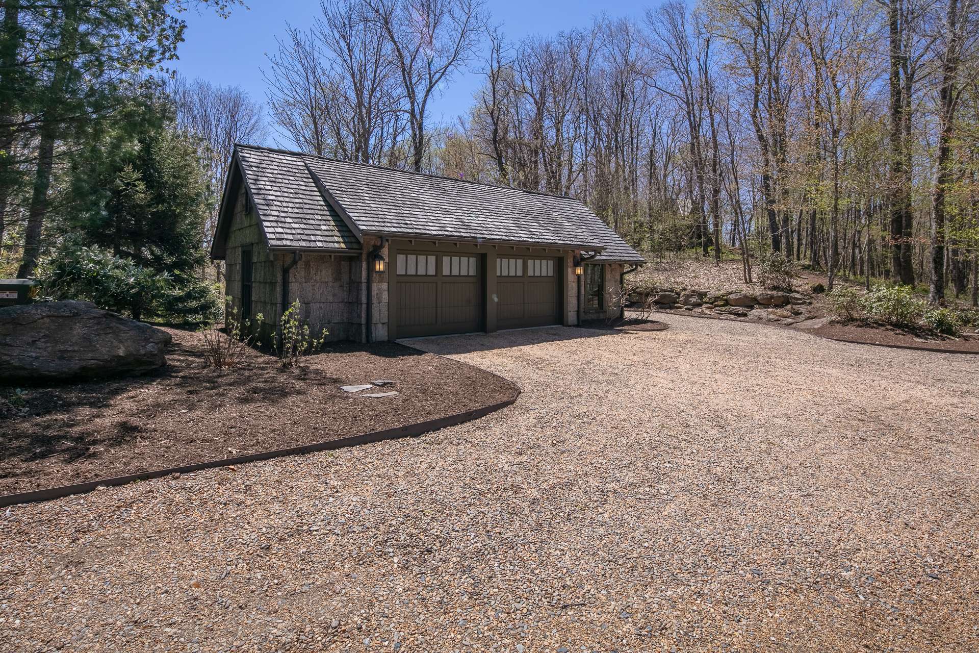 The detached 2-car/2-ATV garage is oversized and provides space for storing yard equipment and/or canoes and kayaks.