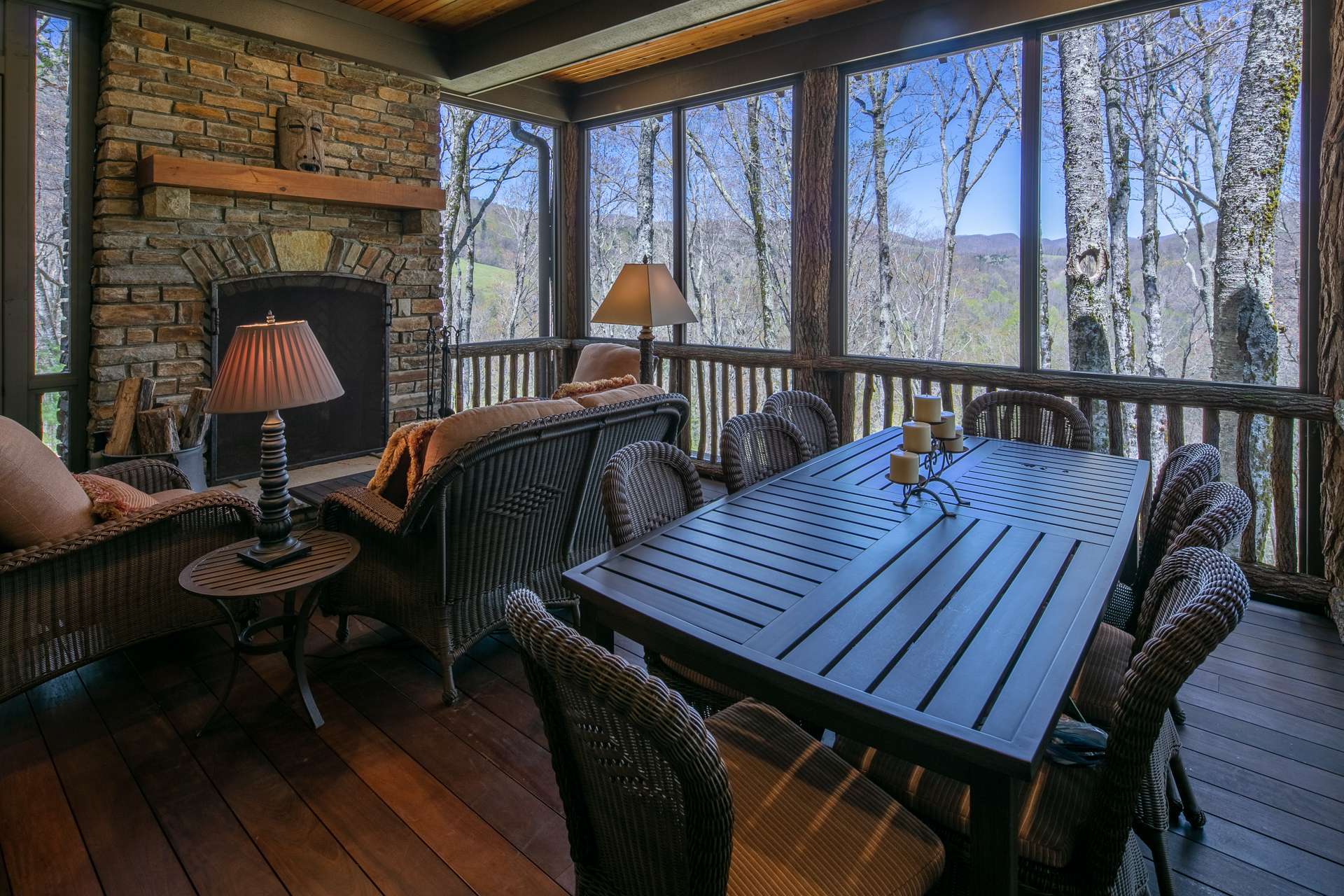 Expanding the living space to the outdoors during warmer months in the mountains, this screened in porch is a peaceful place to enjoy alfresco dining.