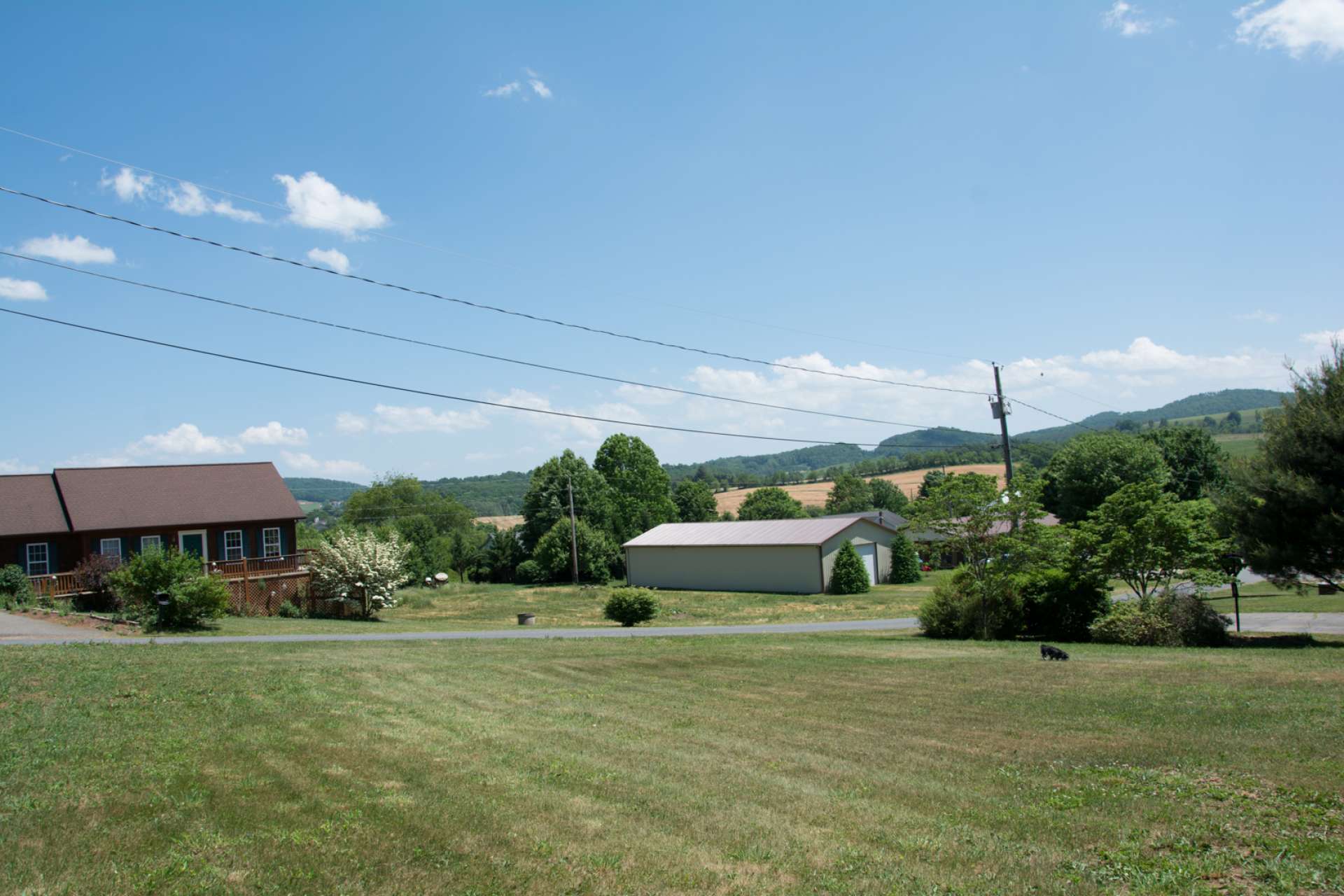 This gently sloping home site offers road frontage, 2-bedroom septic permit and well permit in place, and nice mountain views. This is a modular friendly community, but no mobile homes. There is a 1,000 sq.ft. heated living space minimum restriction.