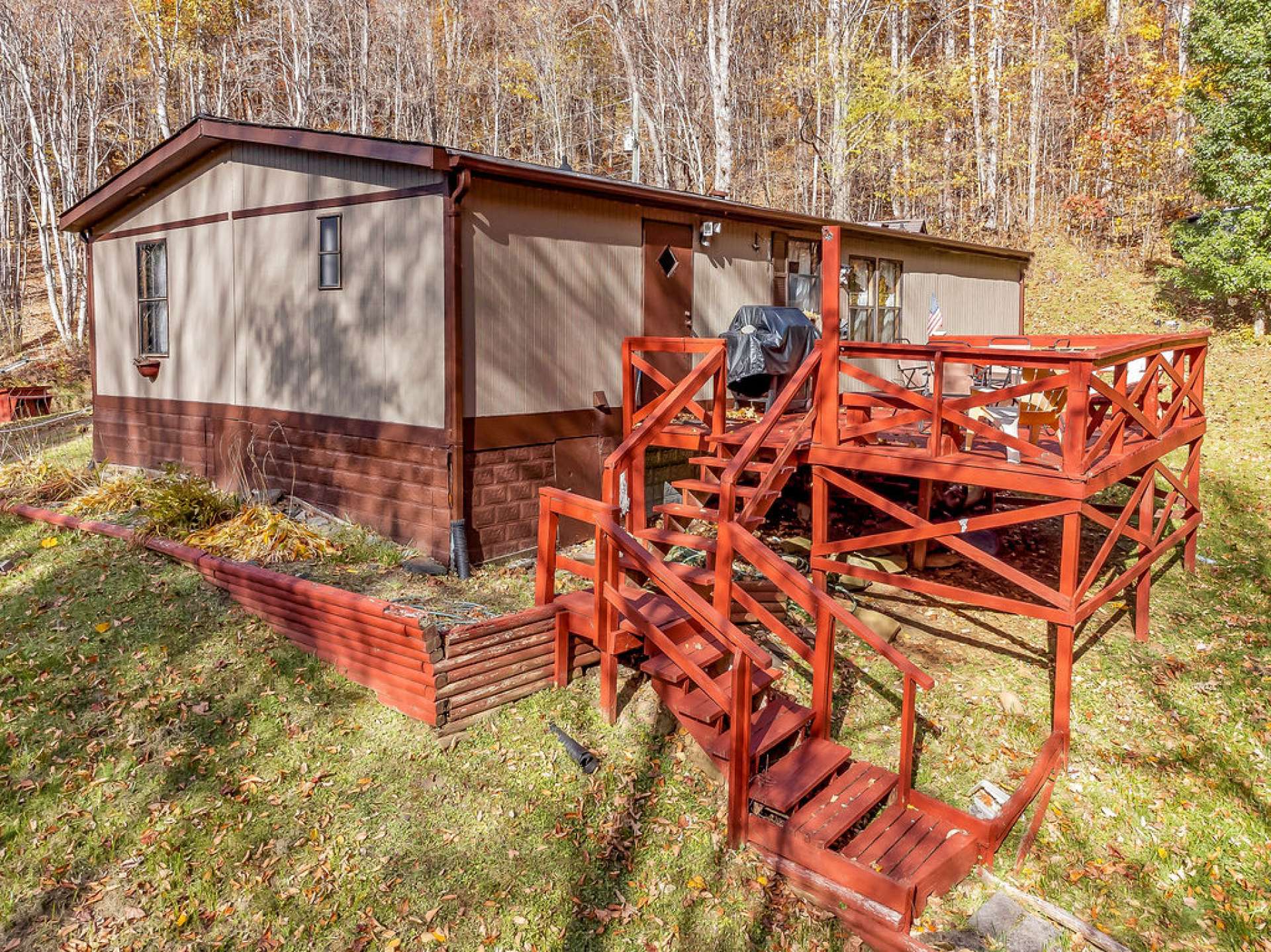 Spacious back deck overlooking the creek.