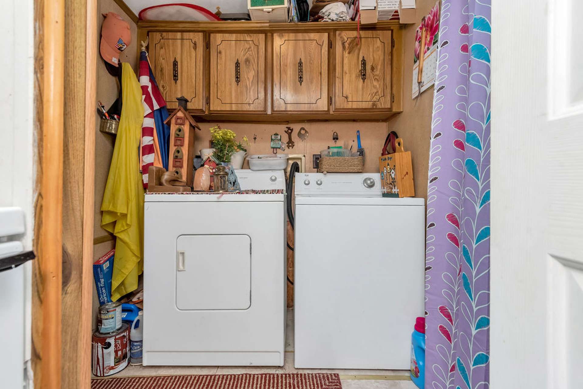 Laundry room off of the kitchen leads to the back deck.