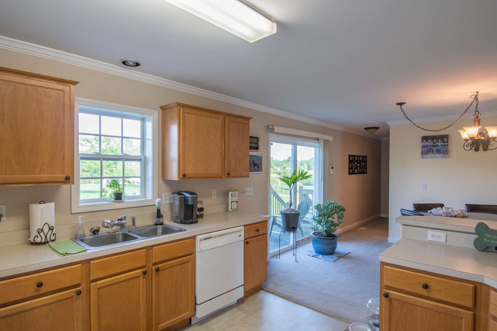 The kitchen and dining areas also have easy access to the back deck for outdoor dining. A half bath and laundry room complete the main level.