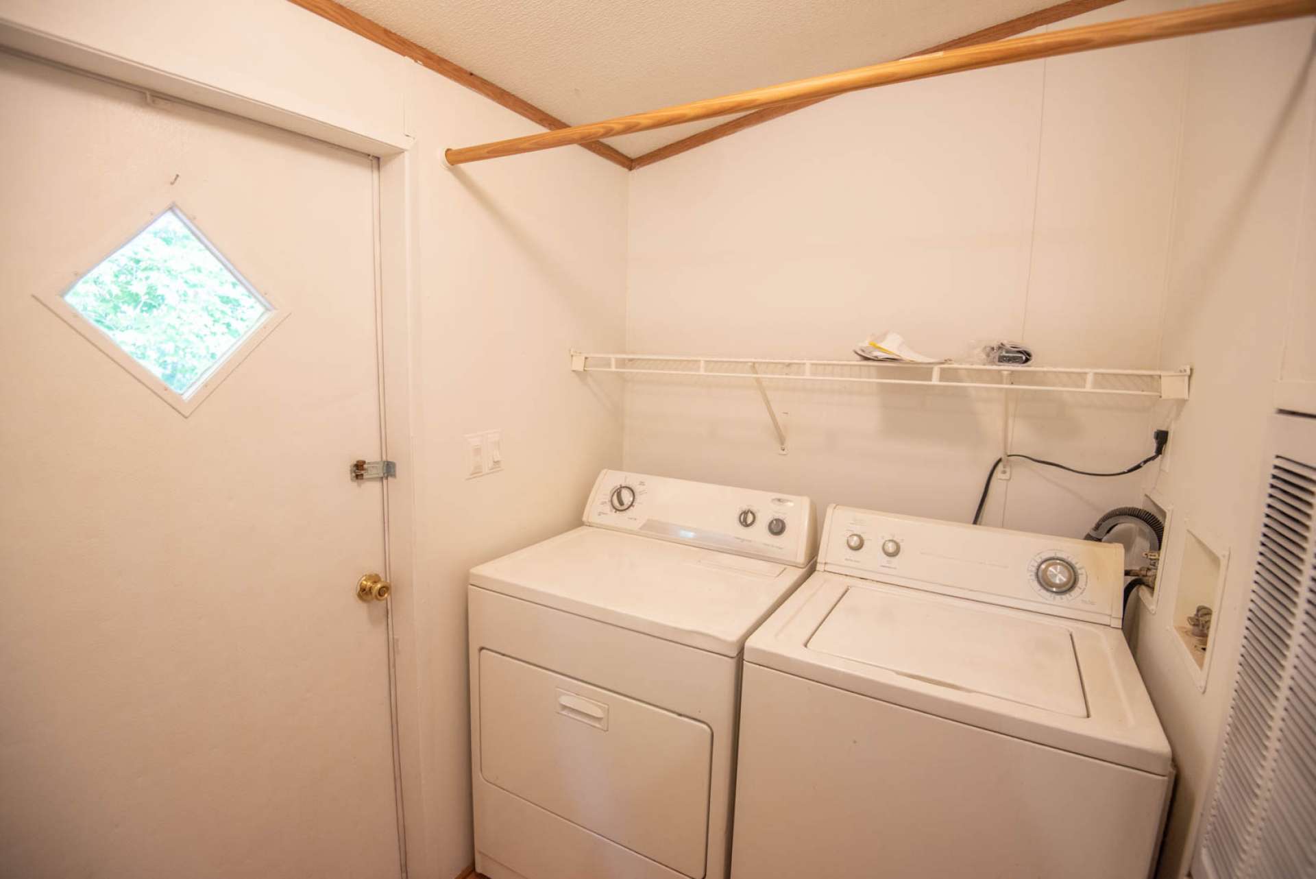 Mud room with laundry area.