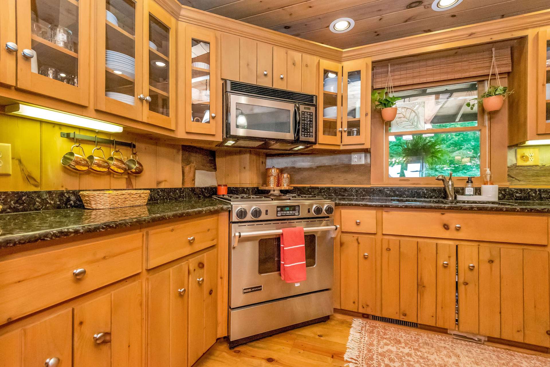 Kitchen is updated with granite countertops and stainless appliances.