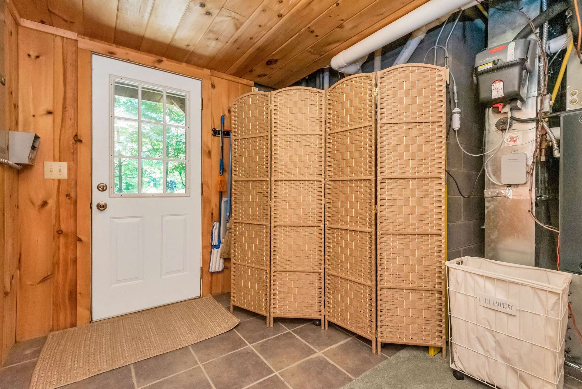 Laundry area has access to outdoors.