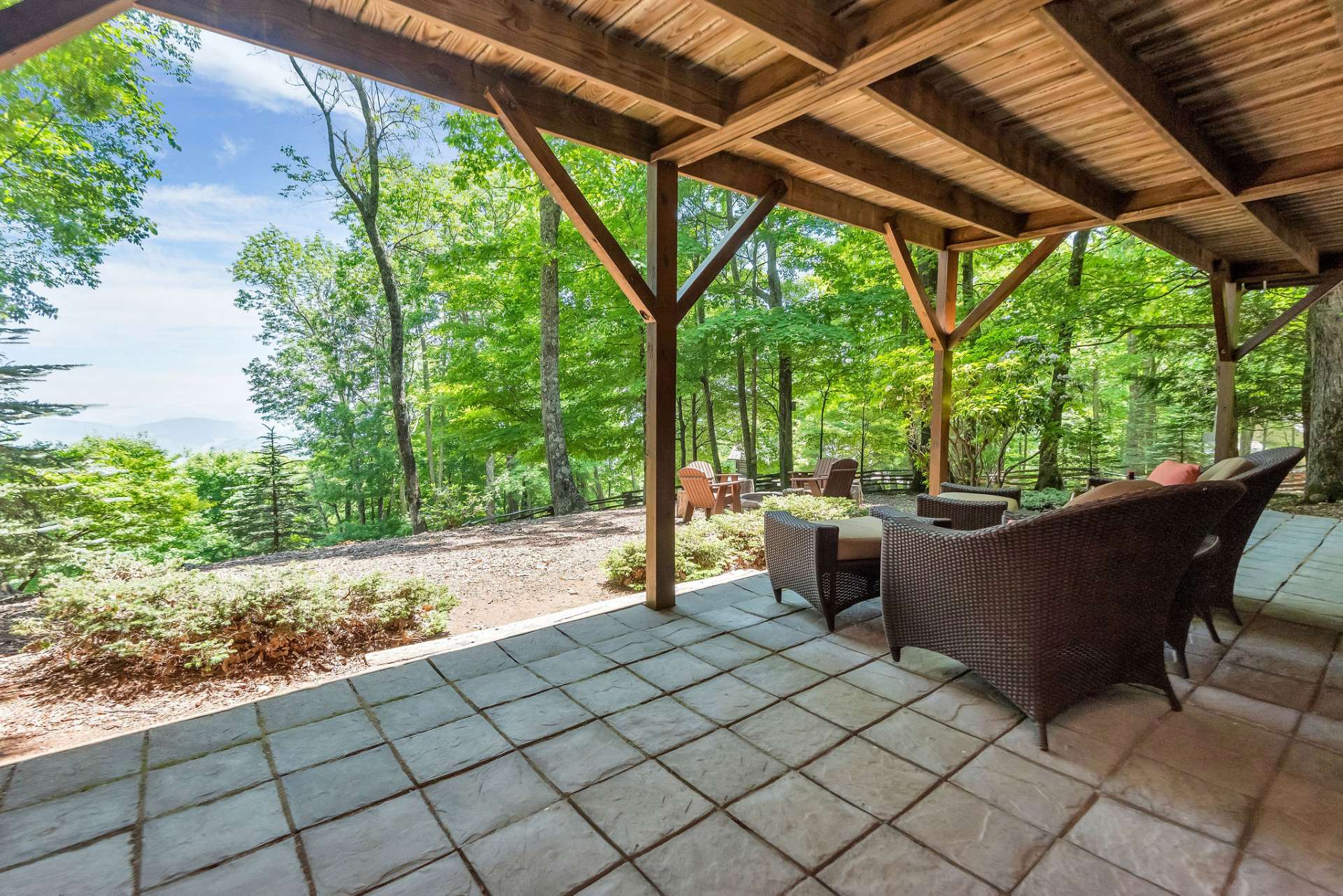 Lower level tiled patio is the perfect place to watch children or your furry friends playing in the fully fenced yard.