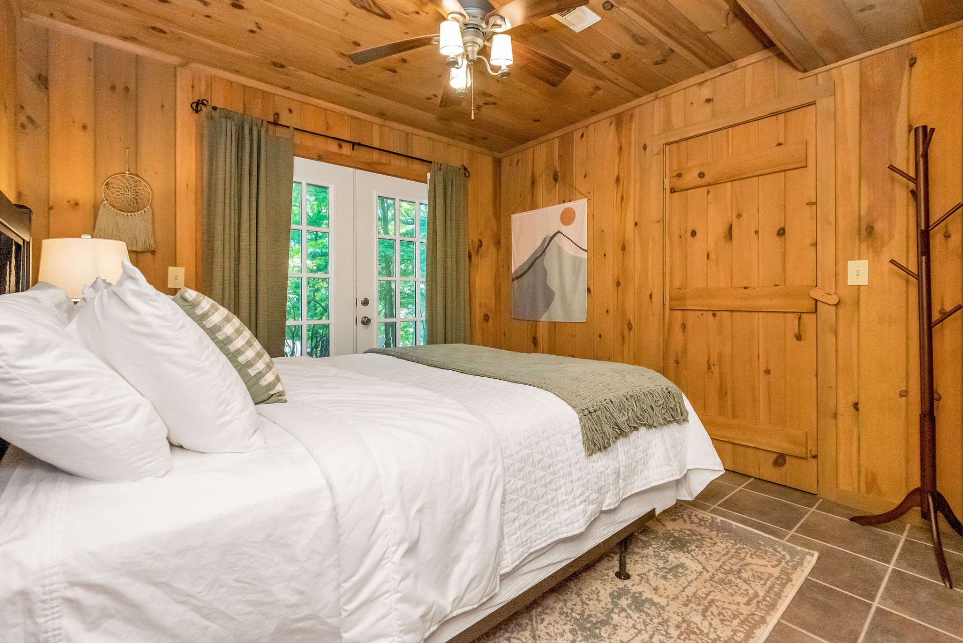 Lower level bedroom has french doors leading to the patio and a large walk-in closet.