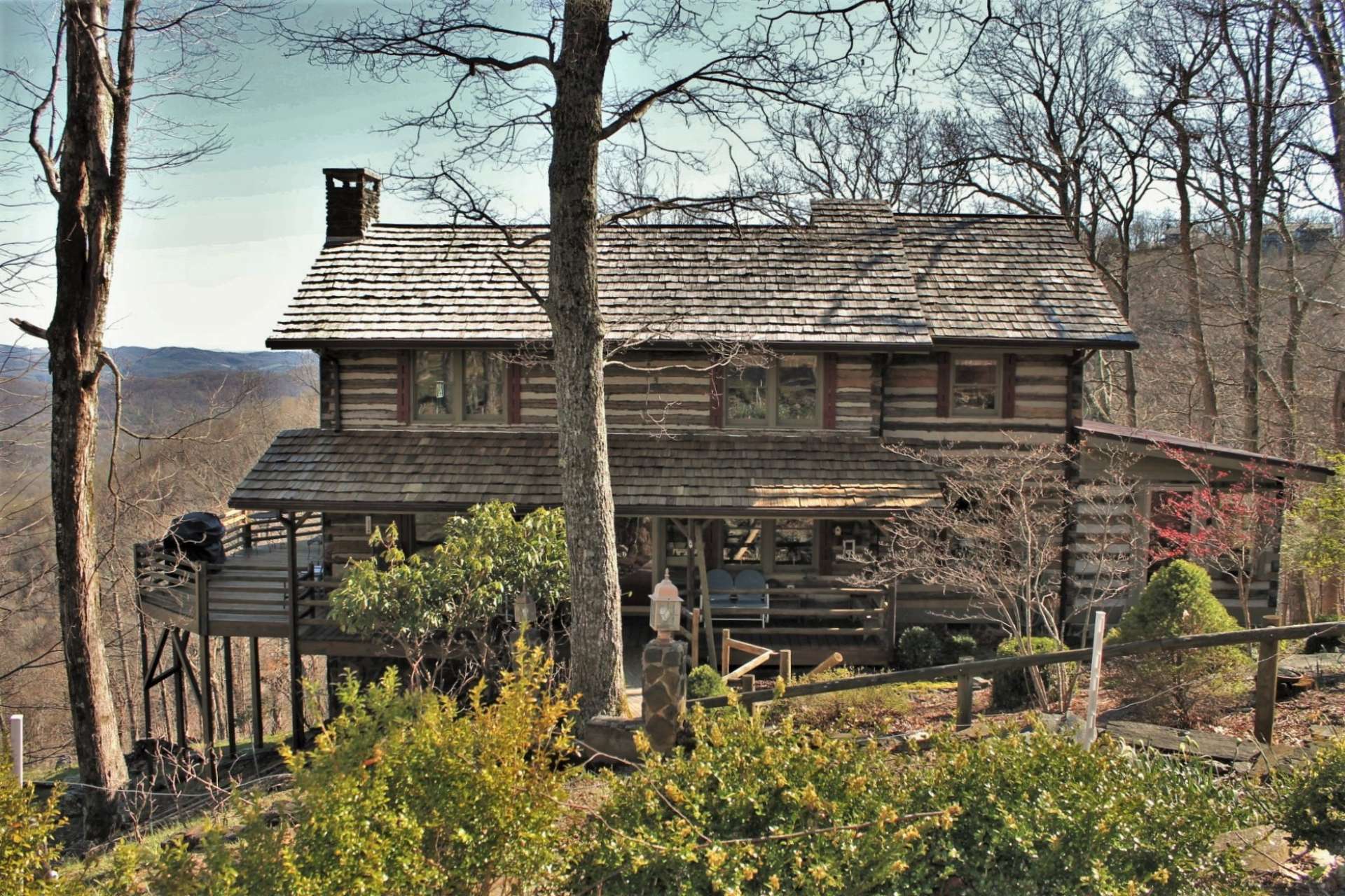 From the back deck of this unique Stonebridge log cabin, there are steps that lead to the lower level unfinished space that can be used as a workshop and storage for your recreational toys such as  mountain bikes, kayaks, and hiking equipment.