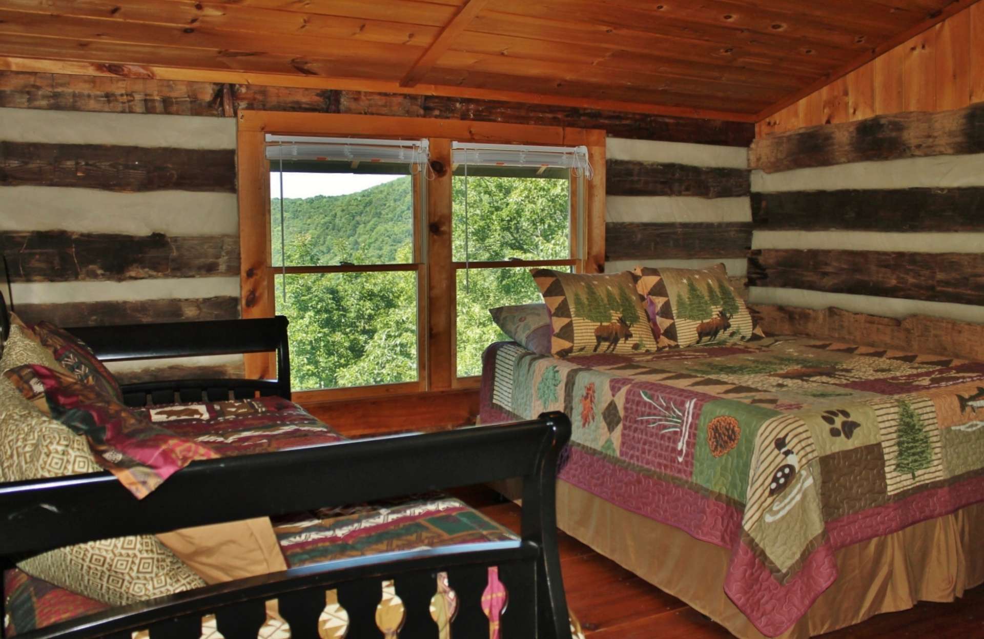 The upper level provides the loft sleeping area, where your guests can also enjoy the views, and a full bath.