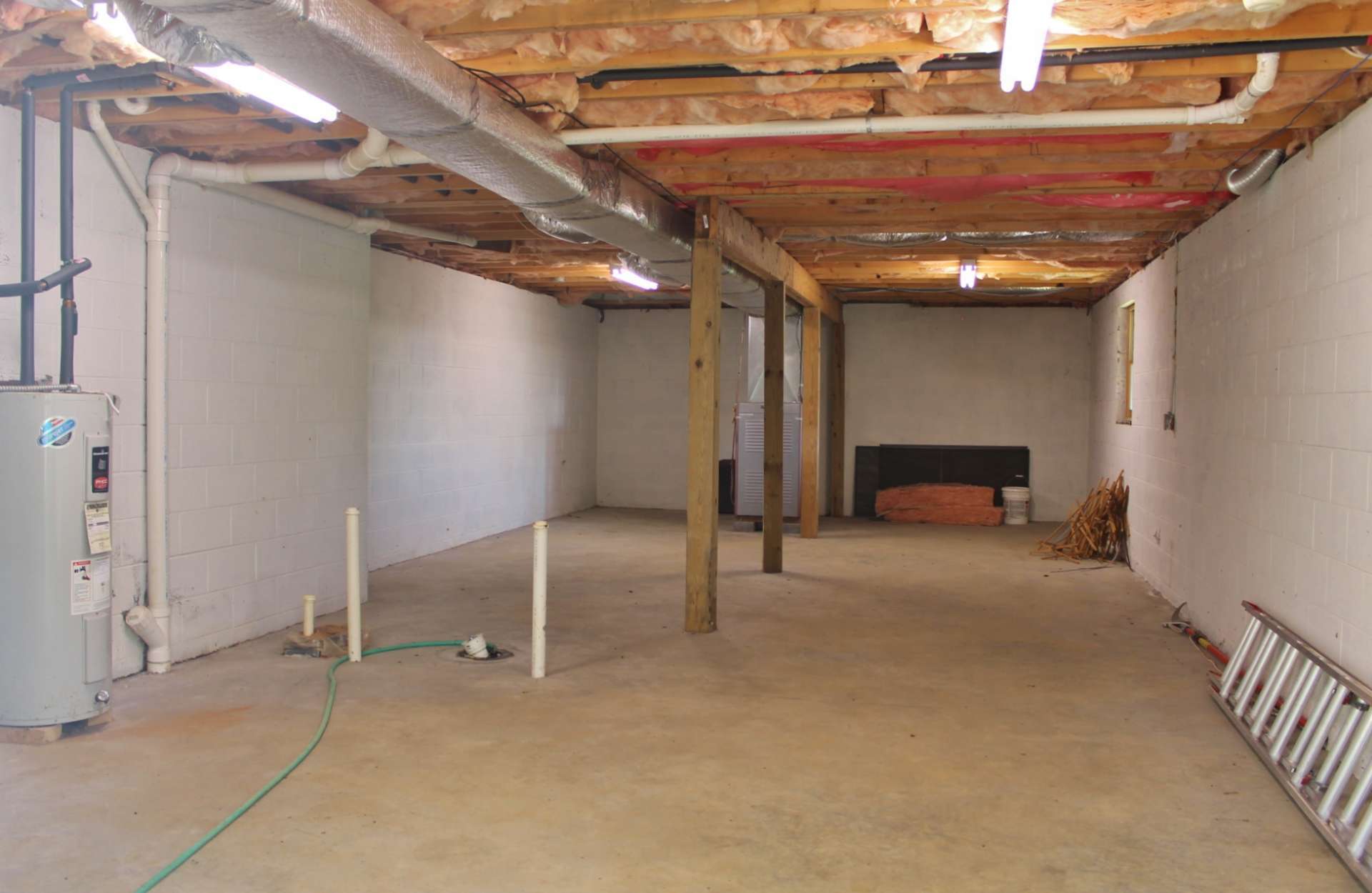 A full walk-out lower level offers a great workshop space that has plumbing stubbed in for future expansion potential. *There is currently no access from inside the house to the lower level.