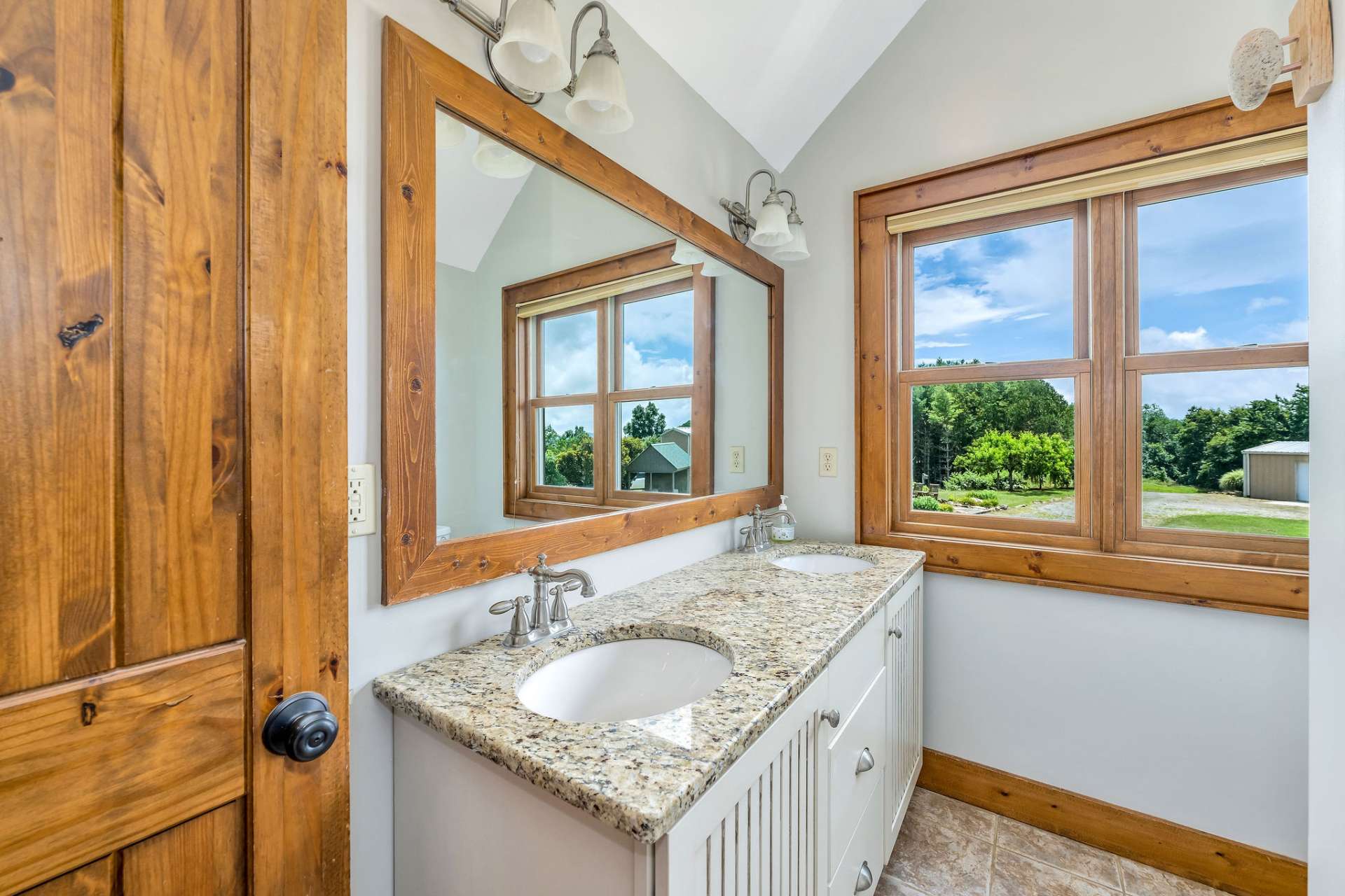 The extra quality of granite counter tops and porcelain tile in each bathroom