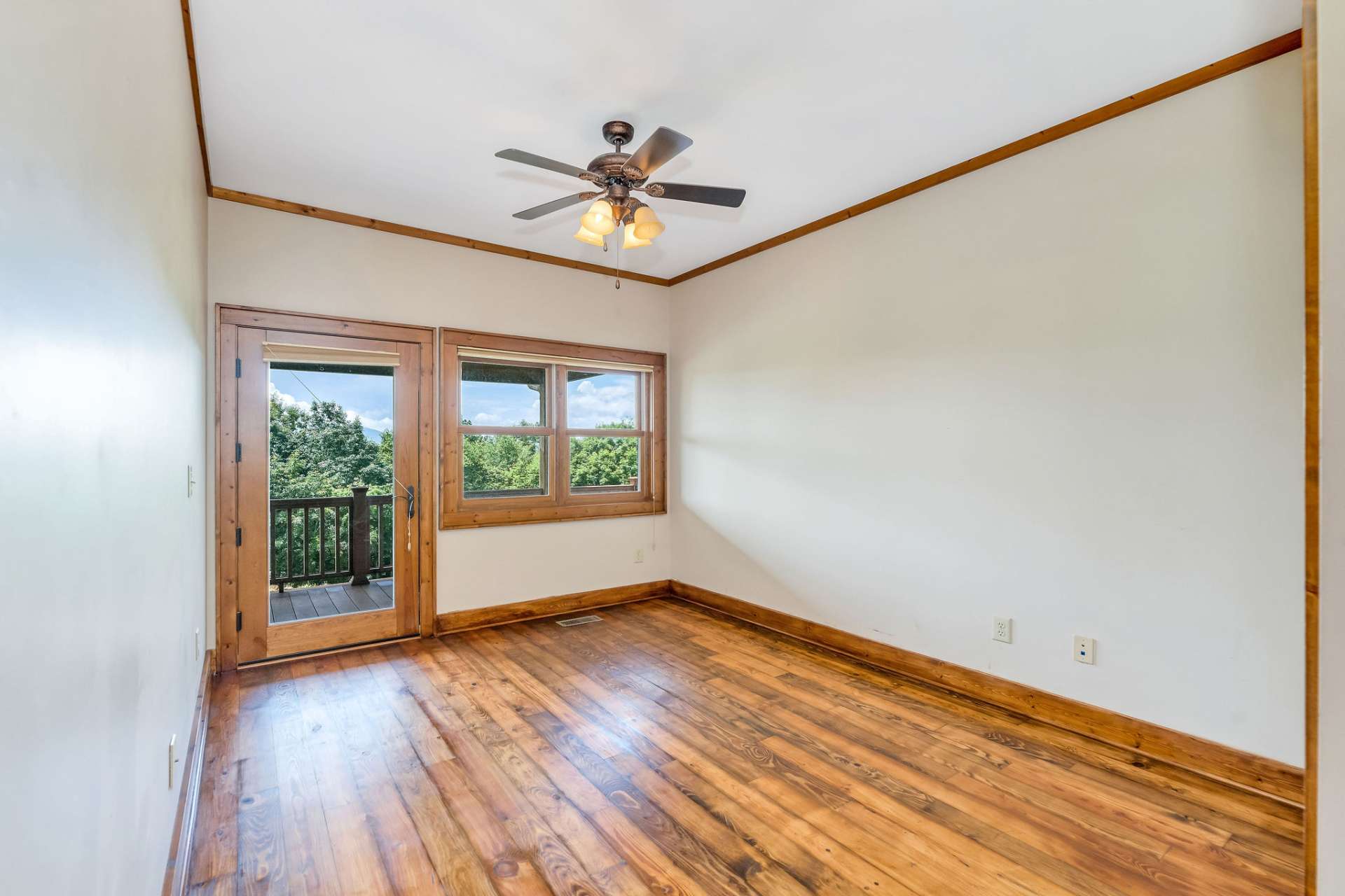 Bedroom located on the main level with additional access to the outdoor living space