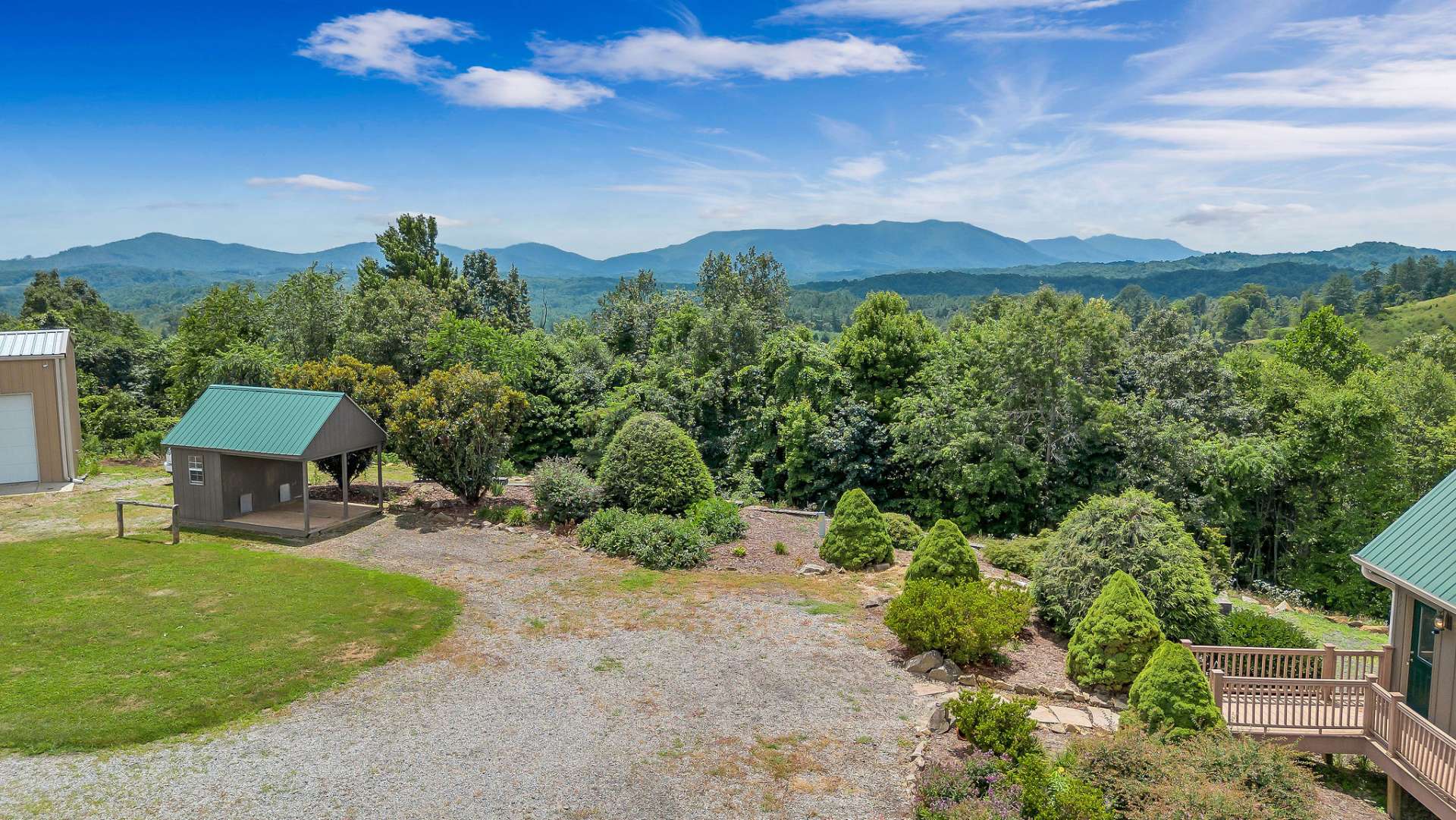 Aerial of your new home with storage building and oversized 3 bay workshop