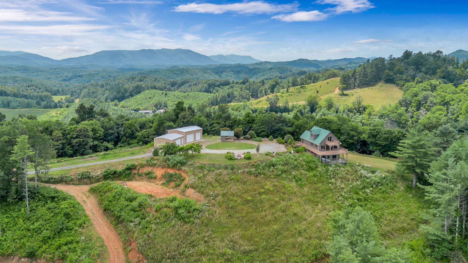 Second aerial that shows the cleared spaces for guest house and barn with ATV trails