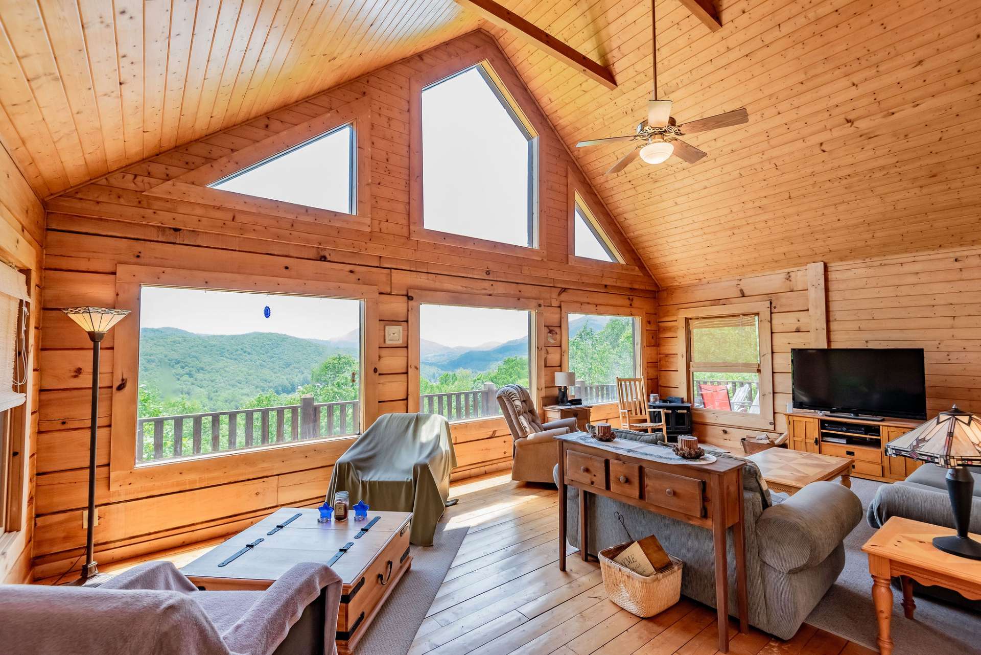 High vaulted ceilings and a wall of windows enhance the open floor plan and fills the great room with natural light.