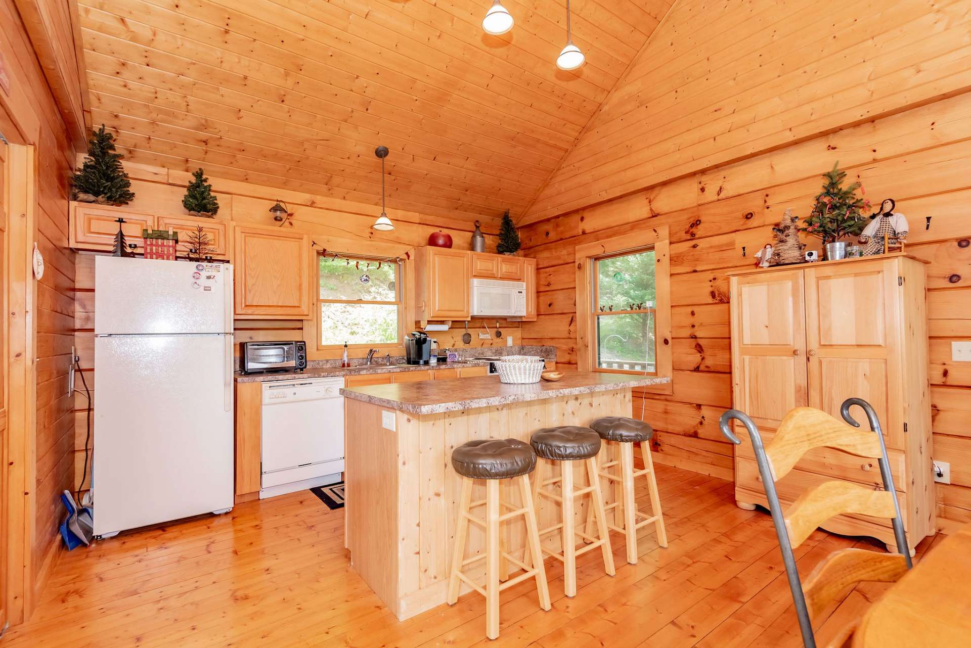 The living area is open to the kitchen and dining areas providing easy transition when entertaining dinner guests.