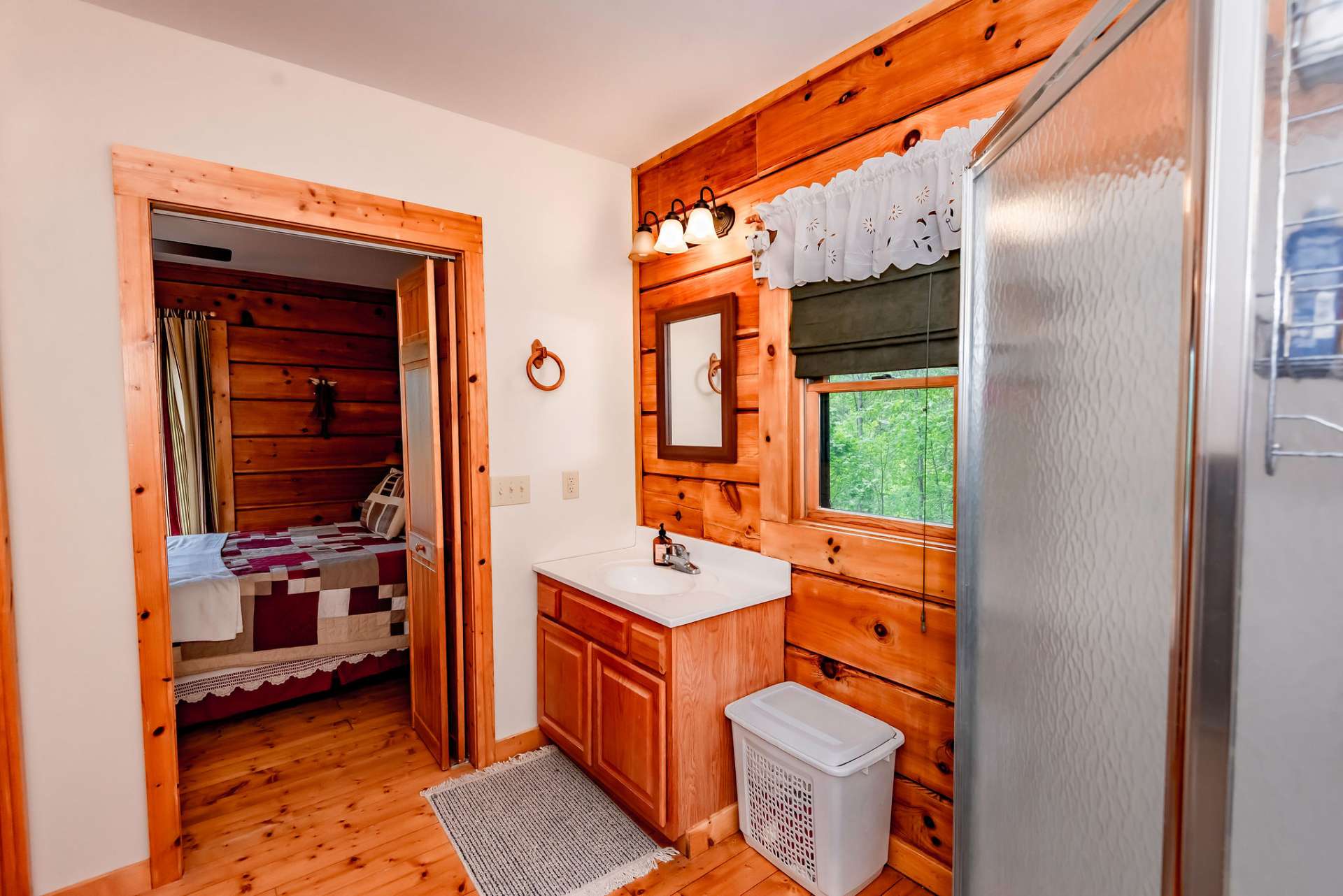 The master bath features a shower unit while the guest bath offers a tub and shower combo.