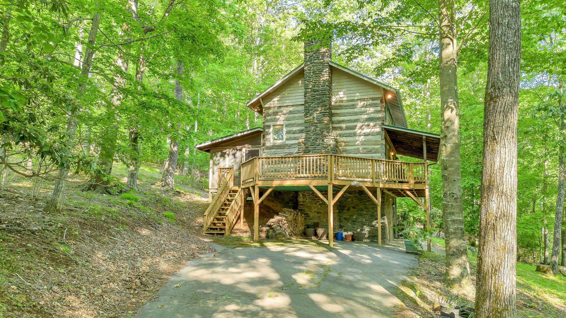 An additional wooded lot behind the cabin offers either a natural sanctuary or the perfect footprint for a future guest cottage.